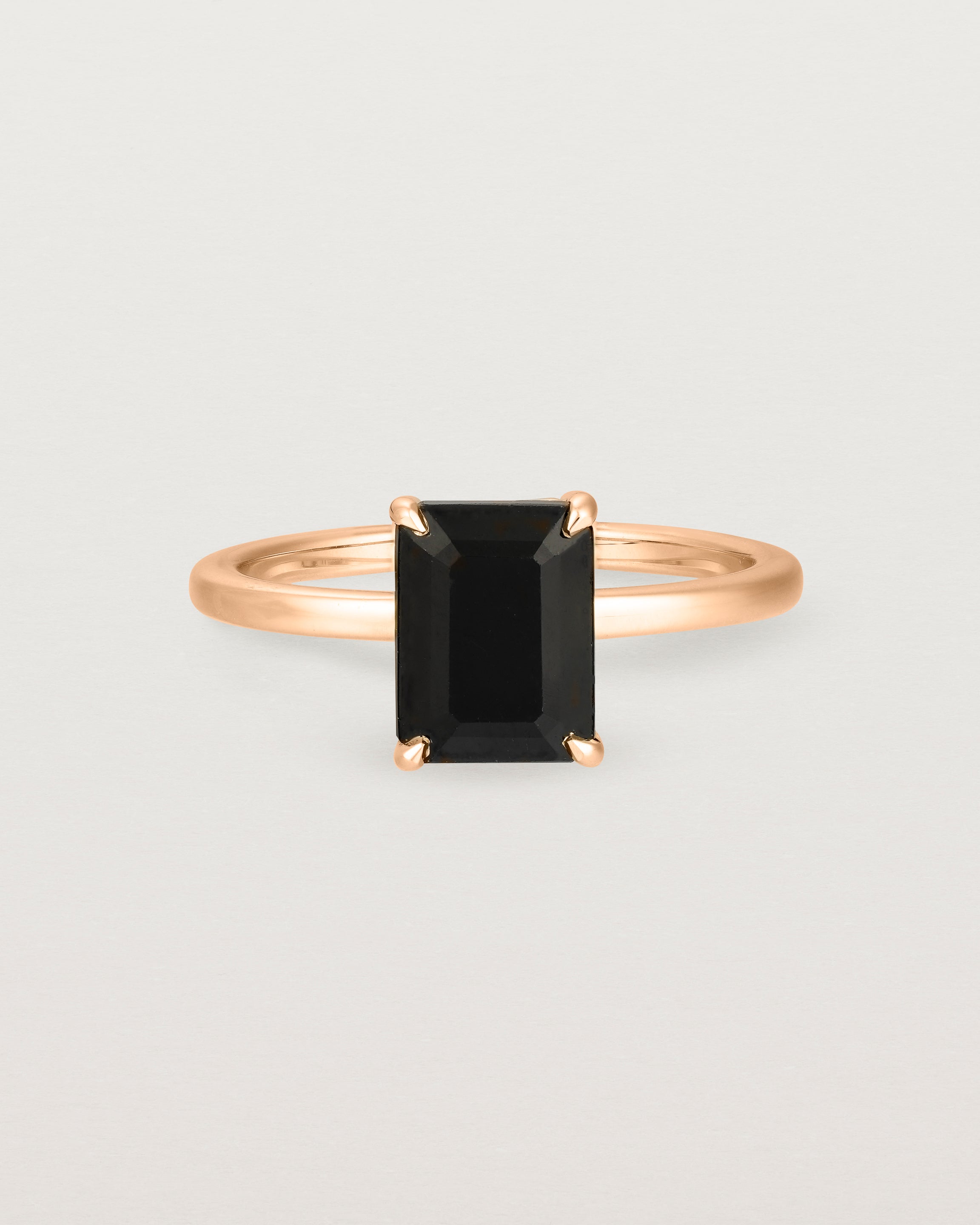 Front view of the Una Emerald Solitaire | Black Spinel | Rose Gold.