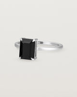 Angled view of the Una Emerald Solitaire | Black Spinel | White Gold.