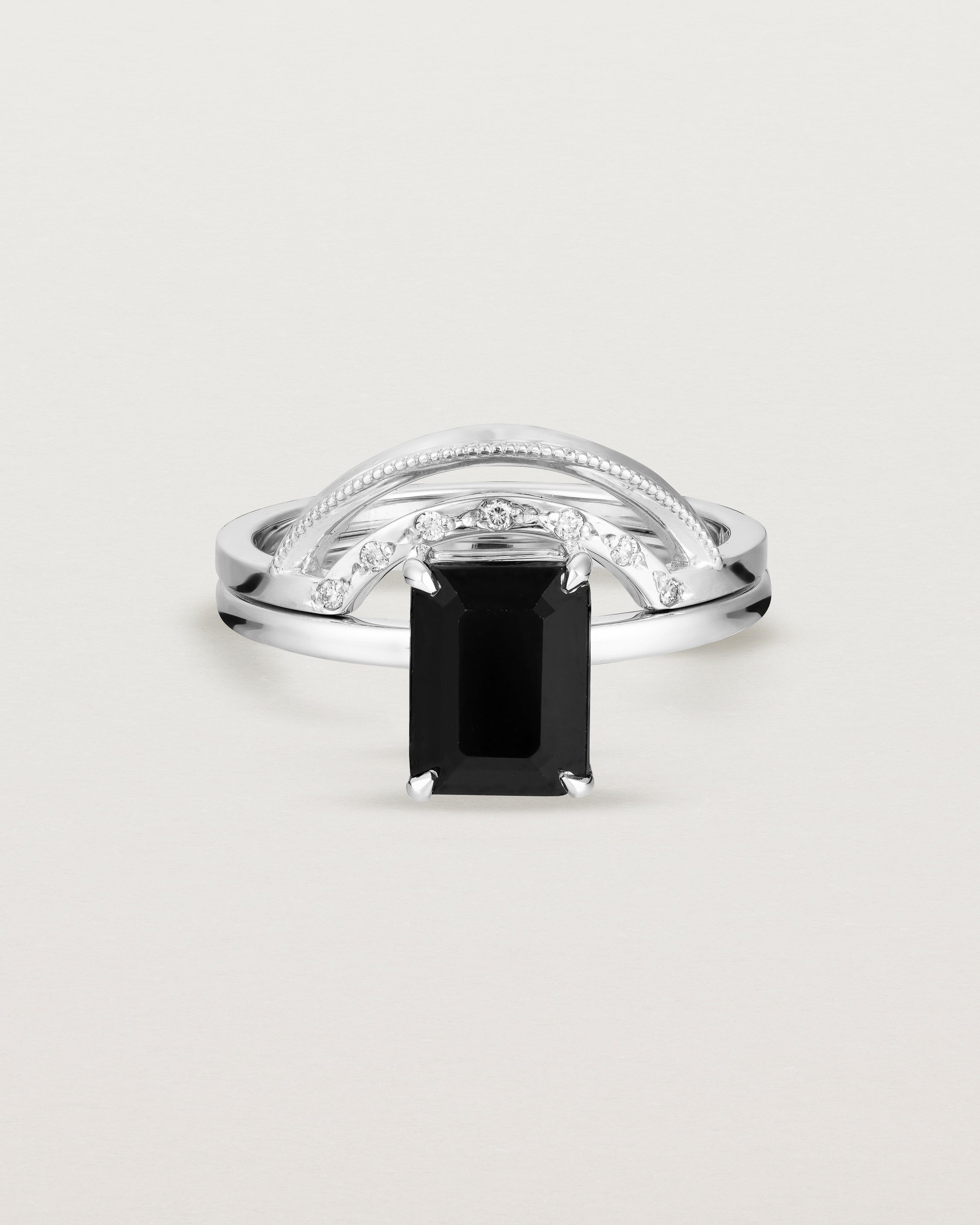 Front view of the Una Emerald Solitaire | Black Spinel | White Gold stacked with the Evette Crown Ring.
