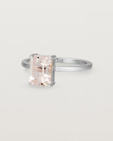Side view of the Una Emerald Solitaire featuring a pale pink morganite