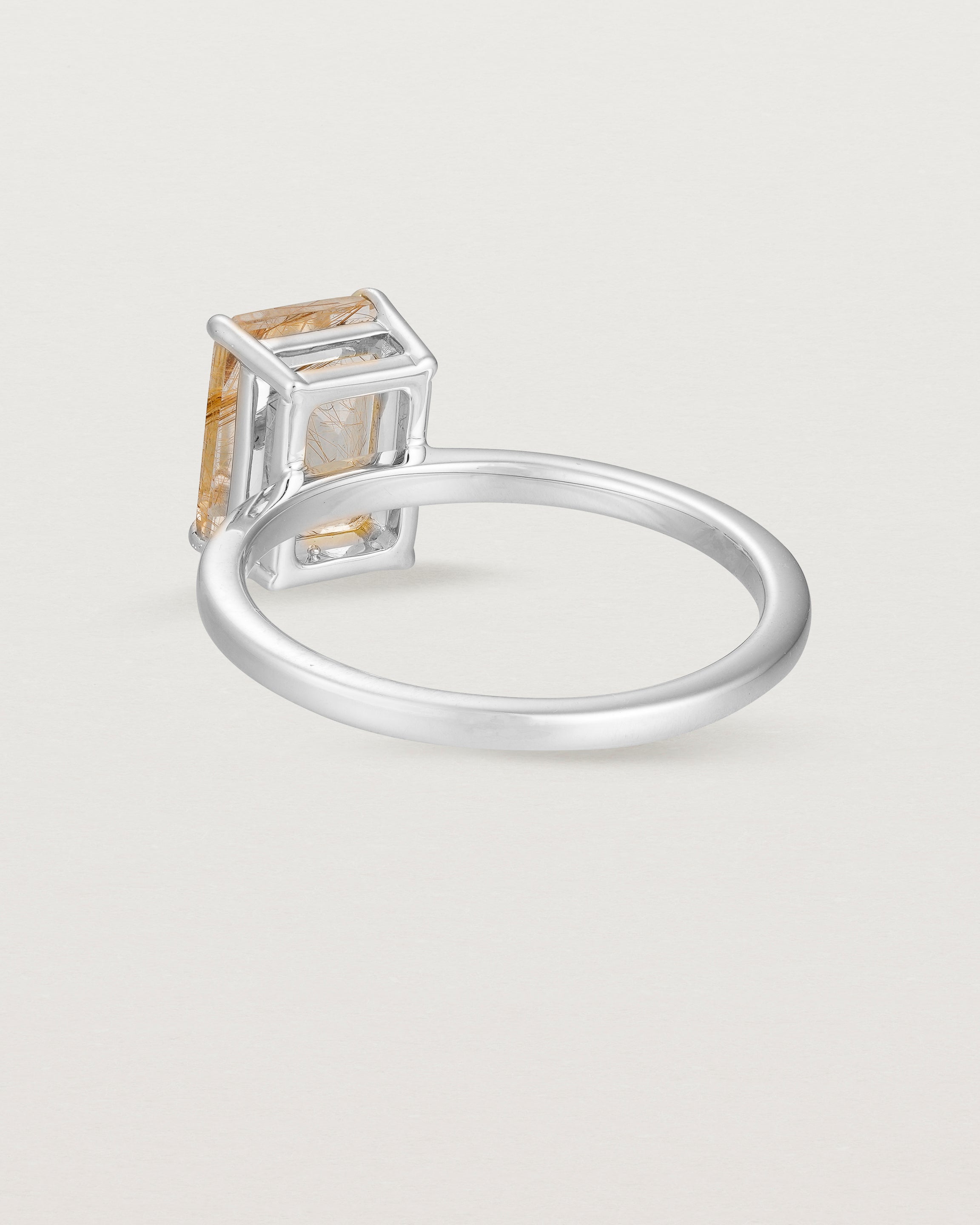 Back view of the Una Emerald Solitaire | Rutilated Quartz | White Gold.
