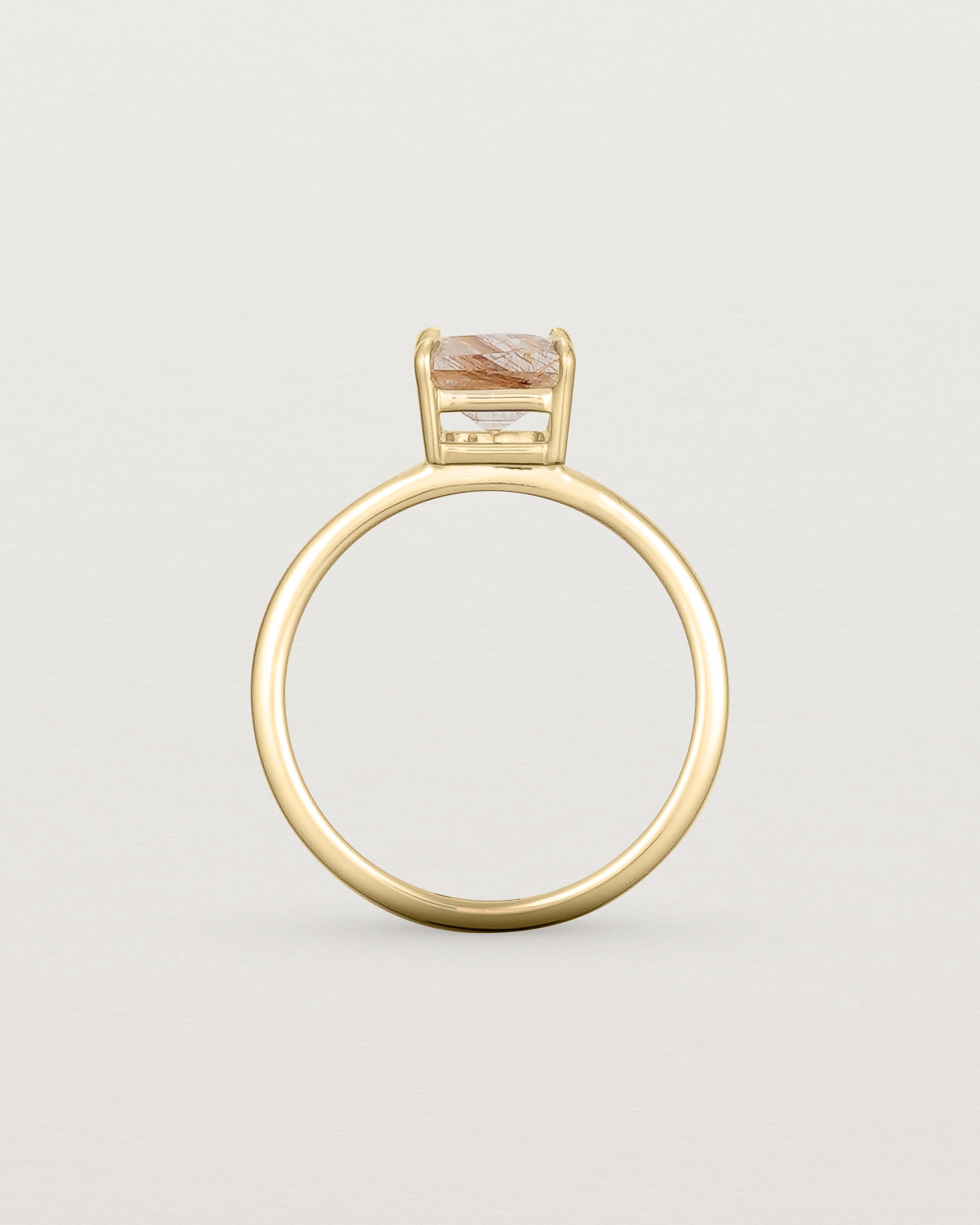 Standing view of the Una Emerald Solitaire | Rutilated Quartz | Yellow Gold.