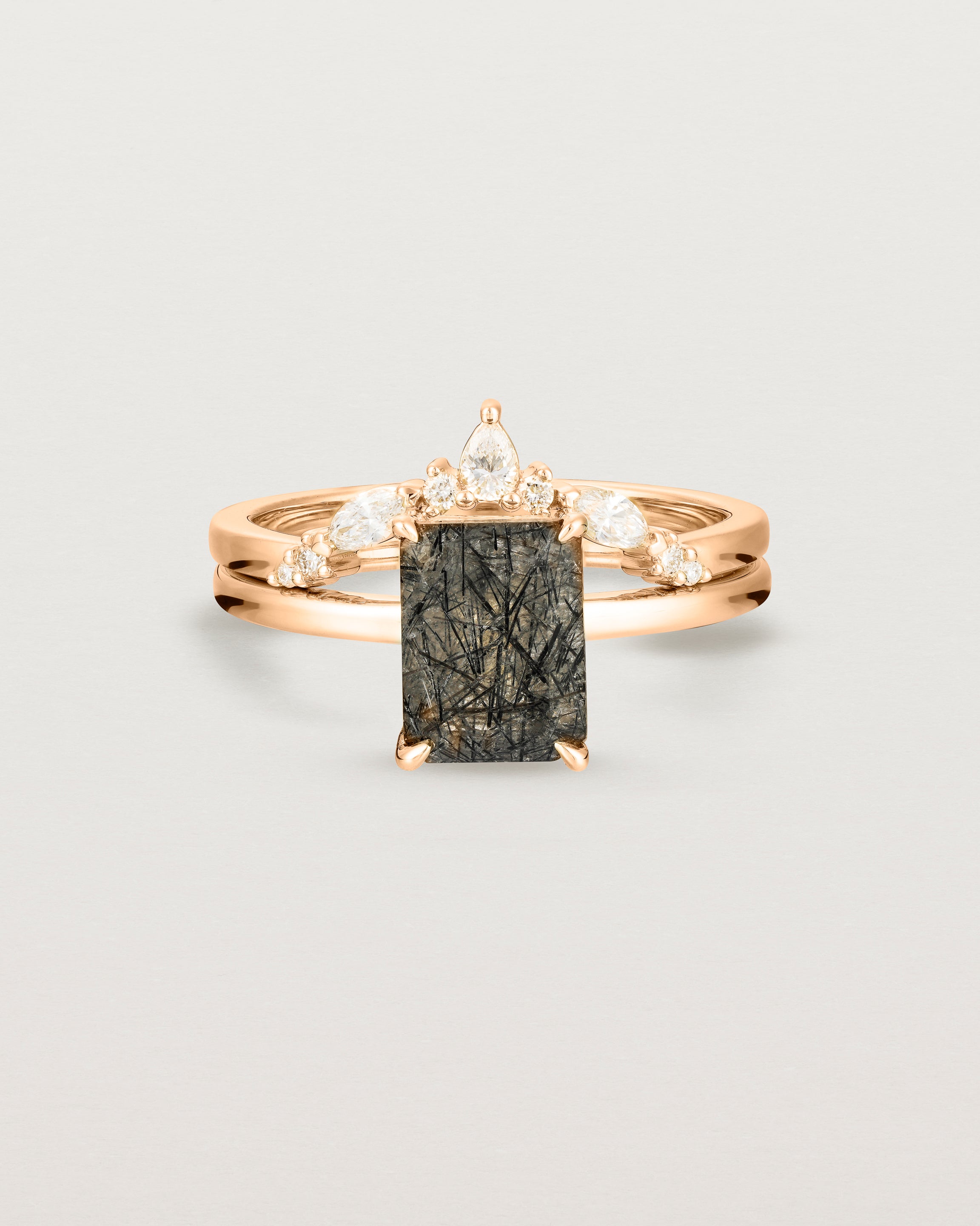 Front view of the Una Emerald Solitaire | Tourmalinated Quartz | Rose Gold stacked with the Meia Crown Ring | Diamonds. 