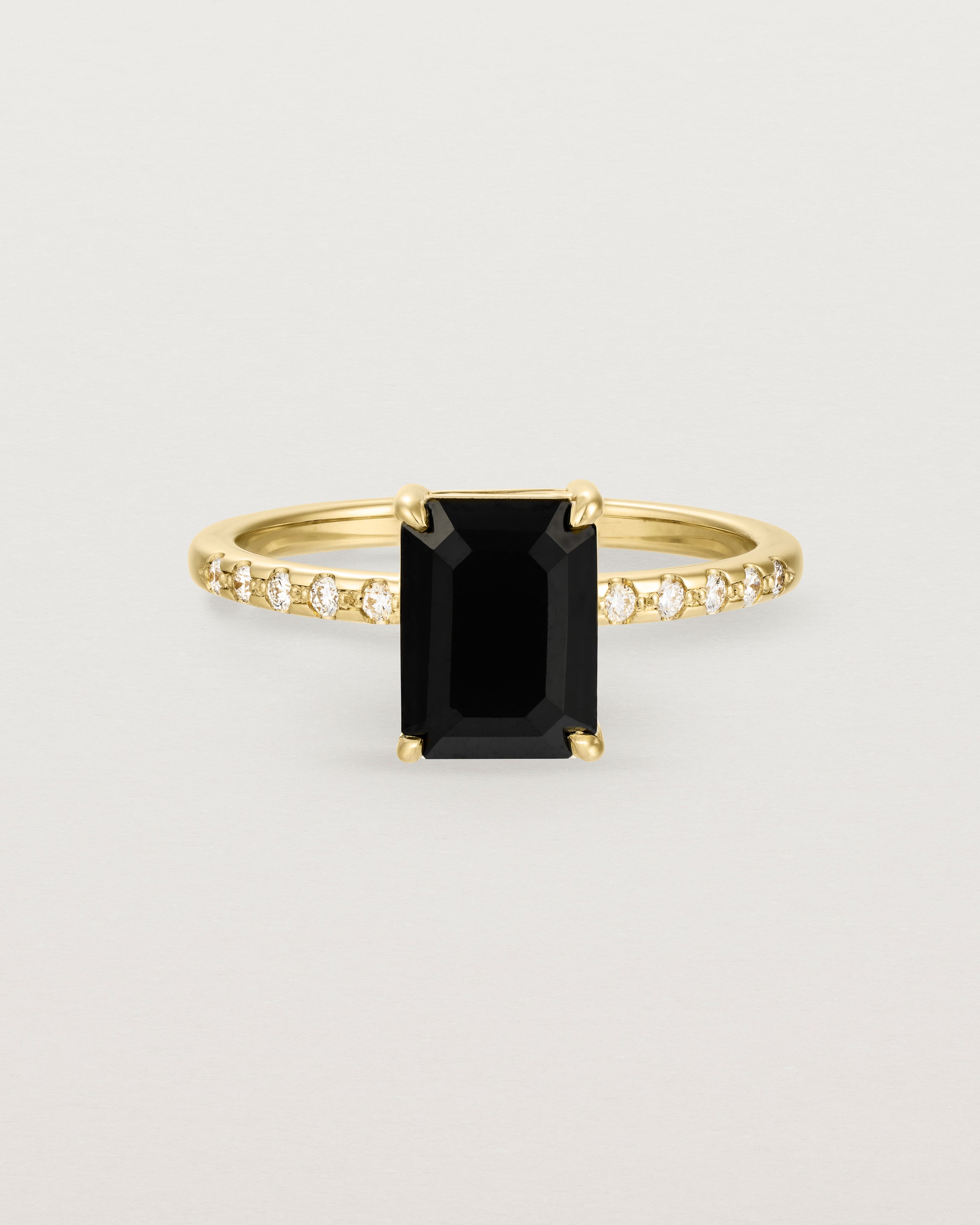 Front view of the Una Emerald Solitaire | Black Spinel | Yellow Gold with Cascade Shoulders.