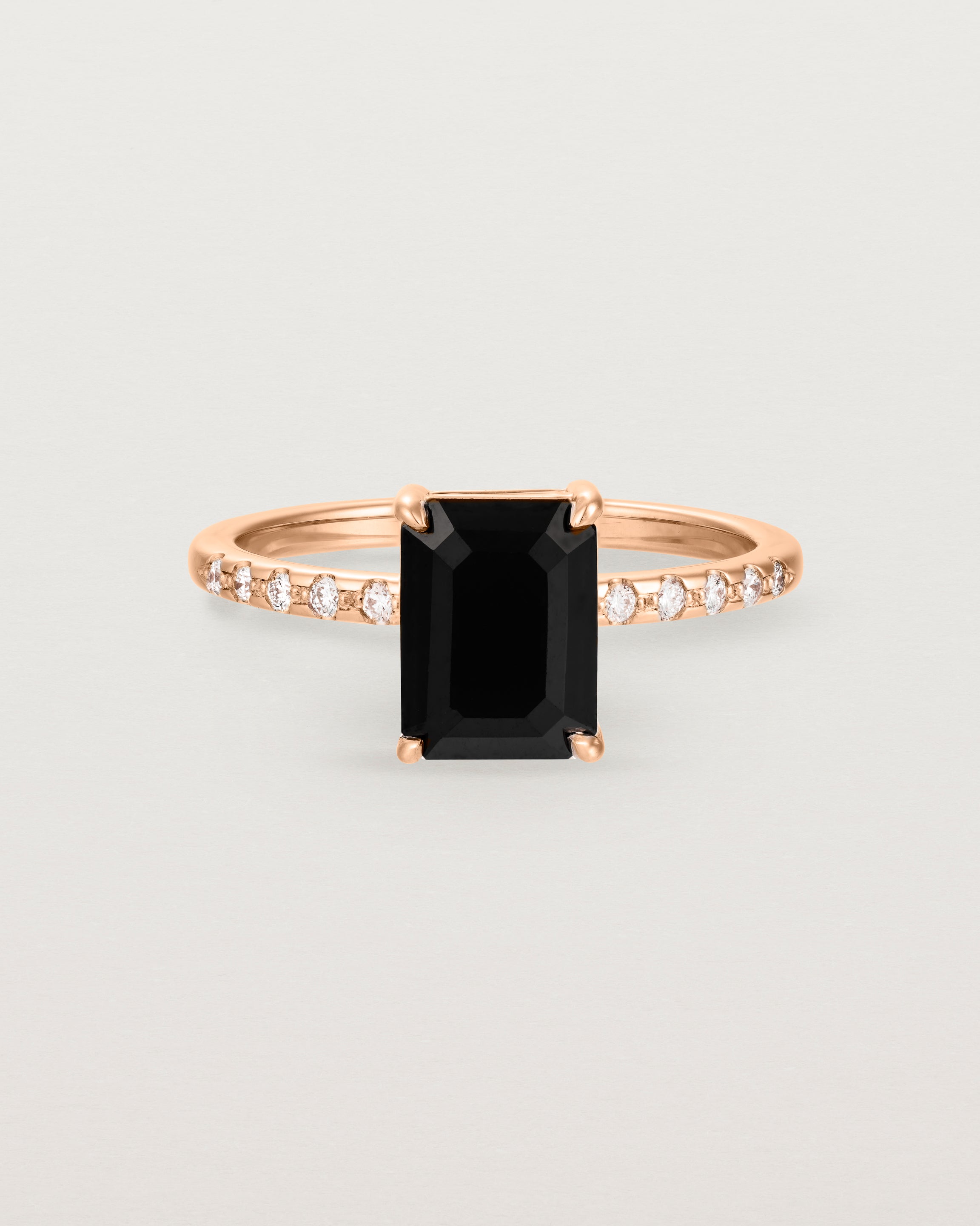 Front view of the Una Emerald Solitaire | Black Spinel | Rose Gold with Cascade Shoulders.