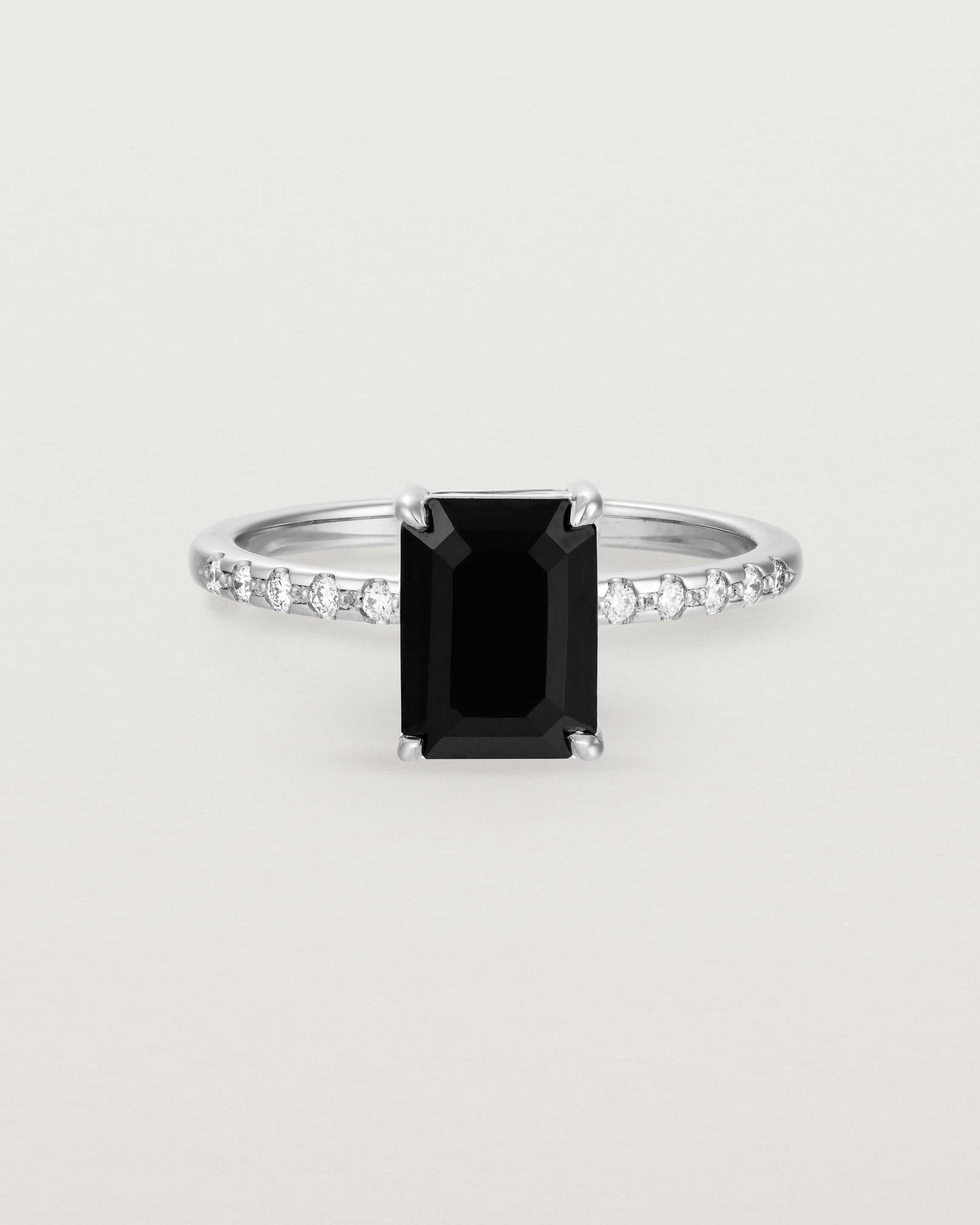 Front view of the Una Emerald Solitaire | Black Spinel | White Gold with Cascade Shoulders.