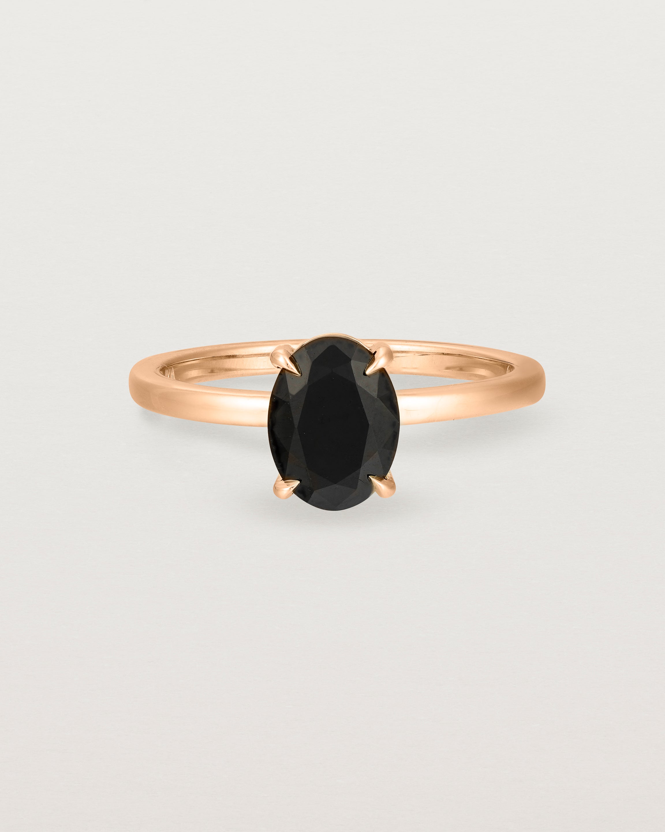 Front view of the Una Oval Solitaire | Black Spinel | Rose Gold.