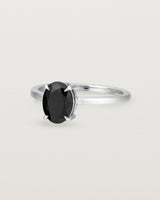 Angled view of the Una Oval Solitaire | Black Spinel | White Gold.