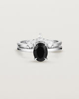Front view of the Una Oval Solitaire | Black Spinel | White Gold stacked with the Odette Crown Ring.