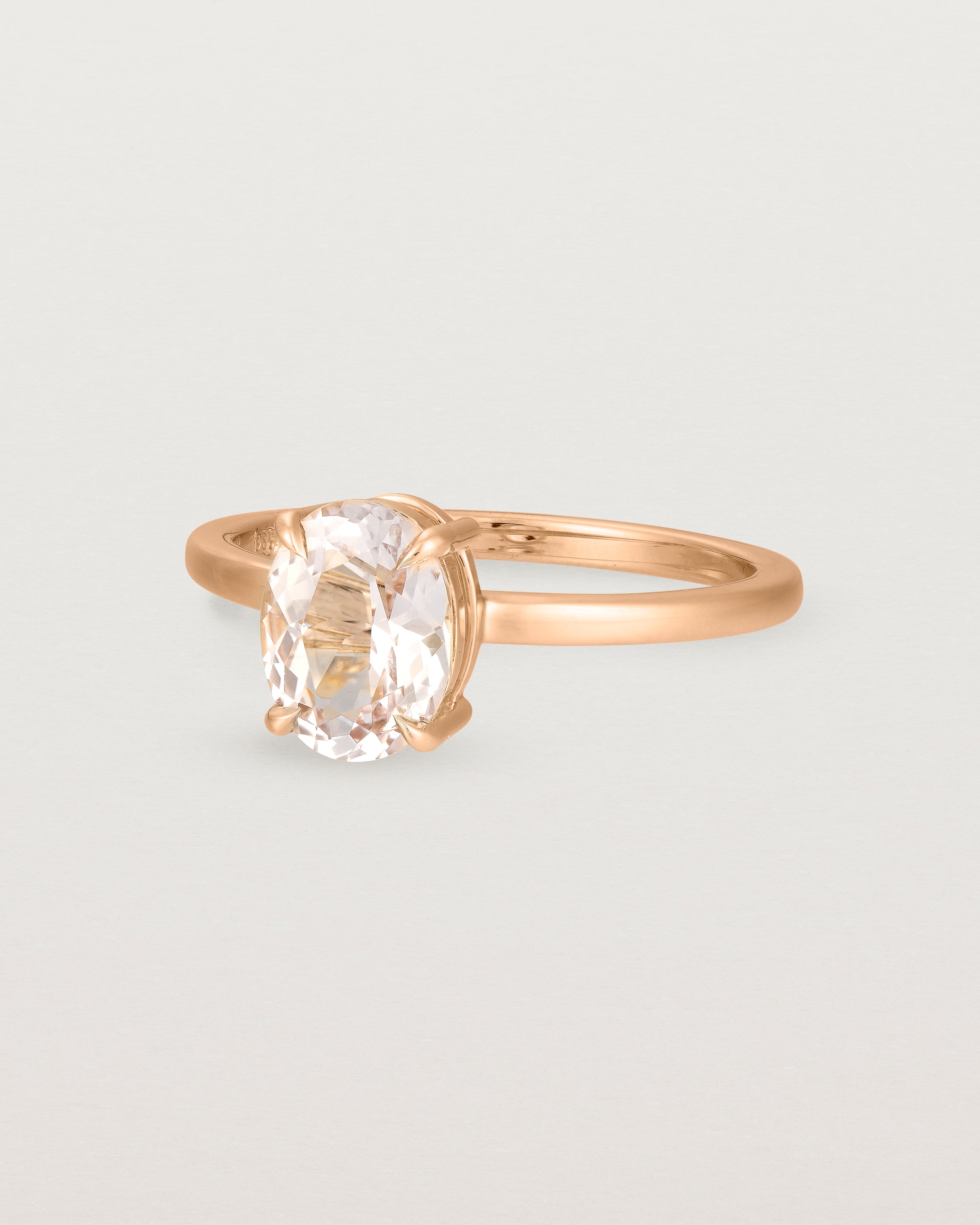 Angled view of the Una Oval Solitaire | Morganite | Rose Gold.