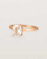 Angled view of the Una Oval Solitaire | Morganite | Rose Gold.