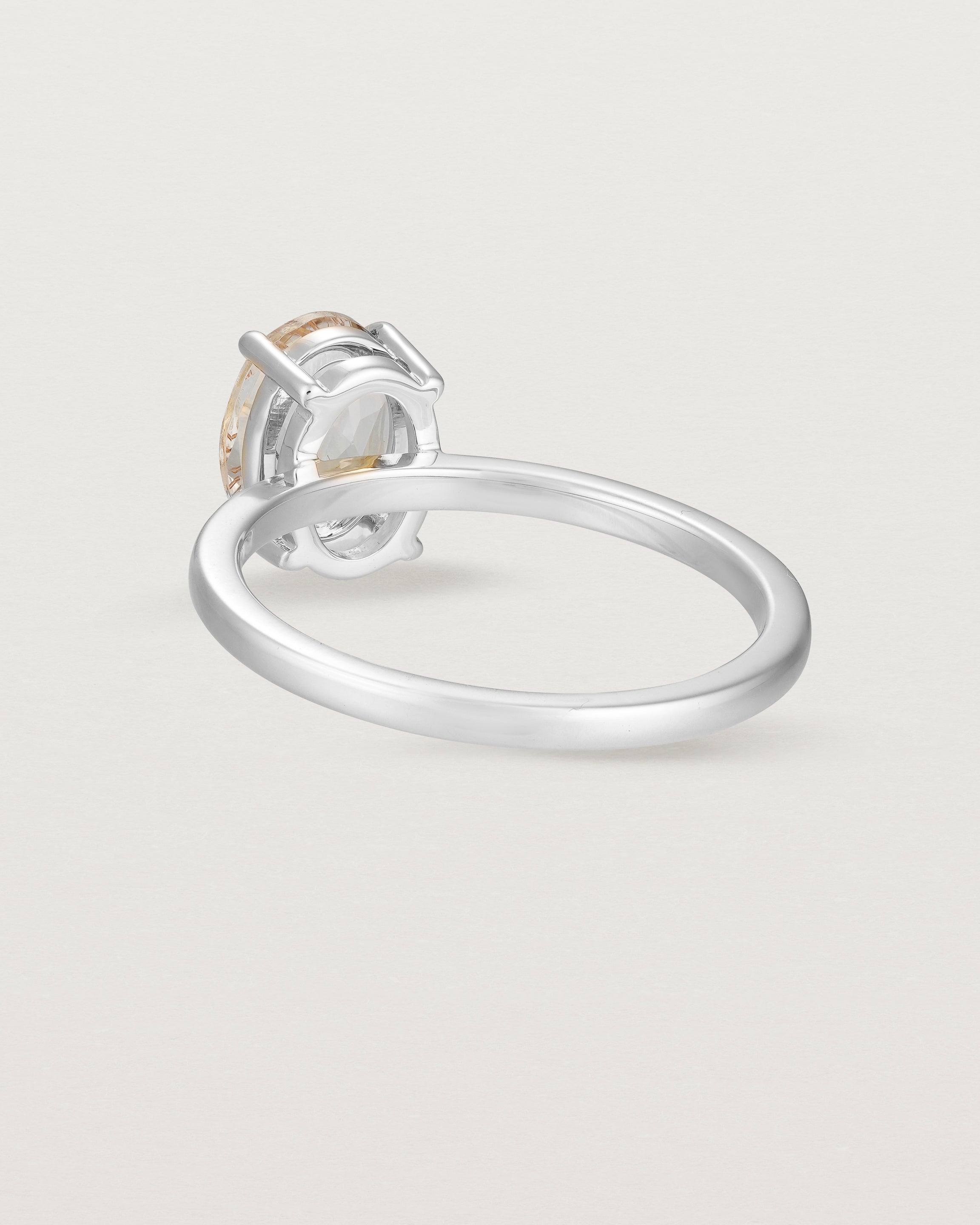 Back view of the Una Oval Solitaire | Rutilated Quartz | White Gold.