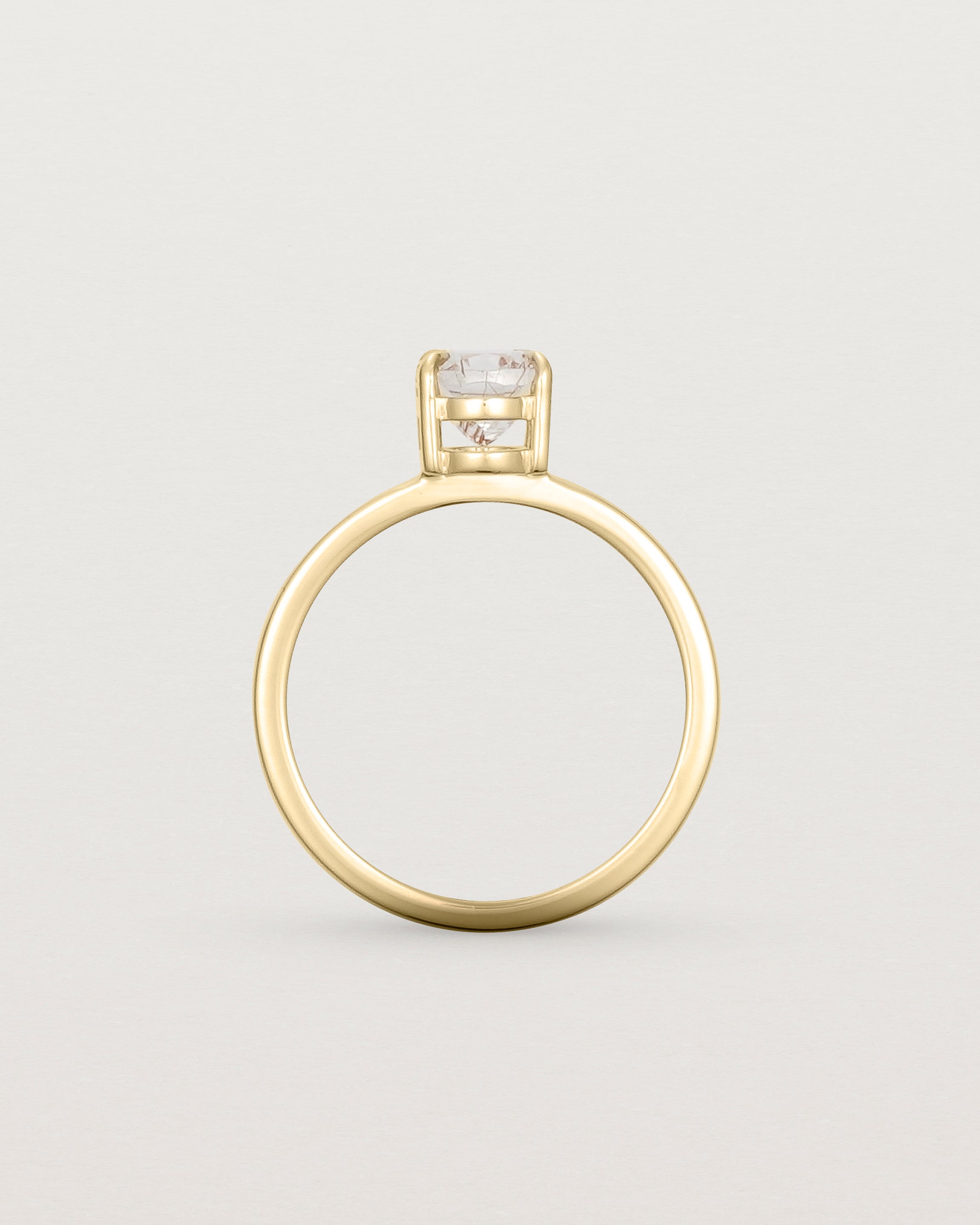 Standing view of the Una Oval Solitaire | Rutilated Quartz | Yellow Gold.