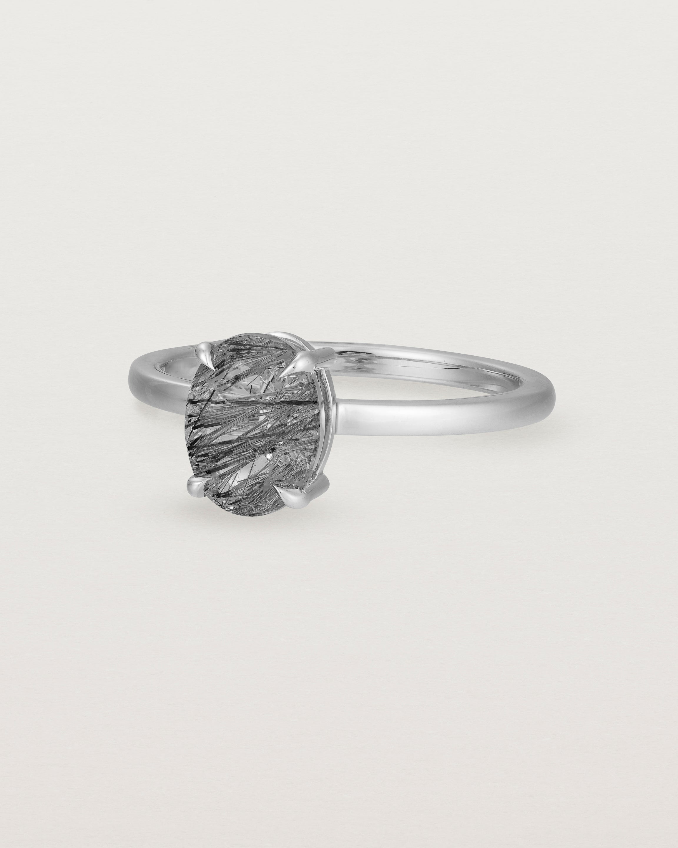 Angled view of the Una Oval Solitaire | Tourmalinated Quartz | White Gold.