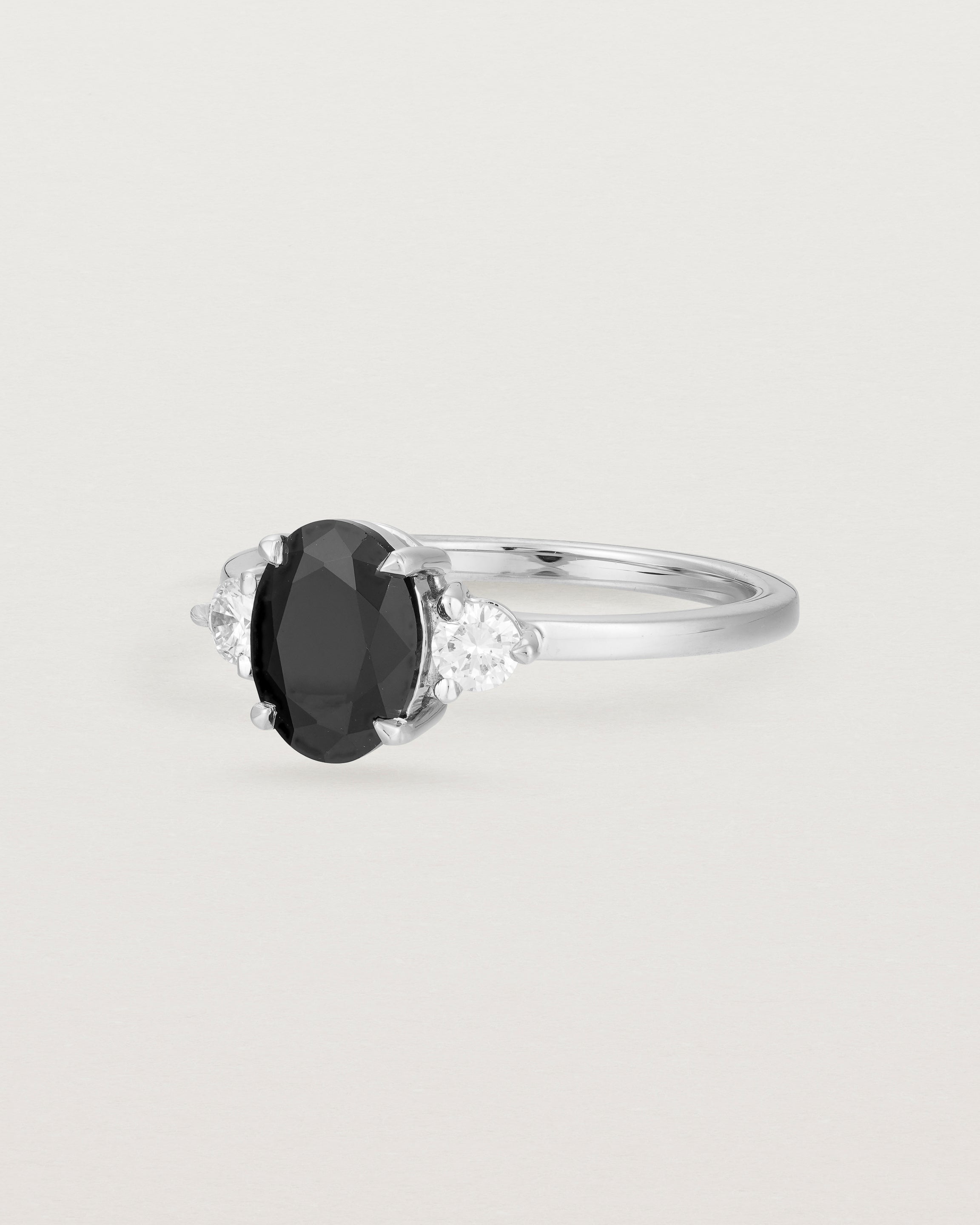 Angled view of the Una Oval Trio Ring | Black Spinel & Diamonds | White Gold.
