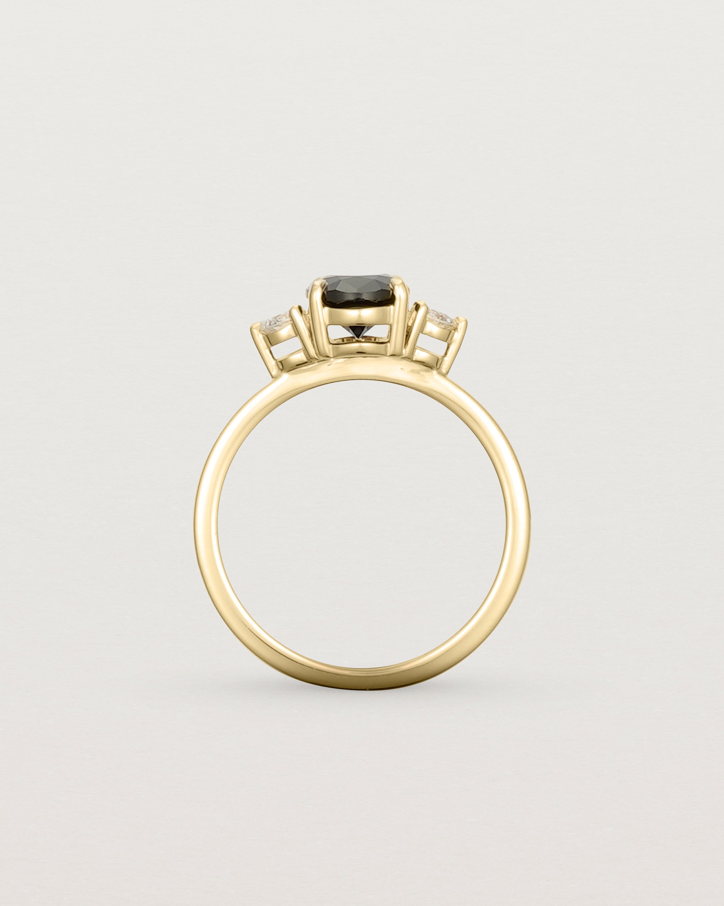 Standing view of the Una Oval Trio Ring | Black Spinel & Diamonds | Yellow Gold.