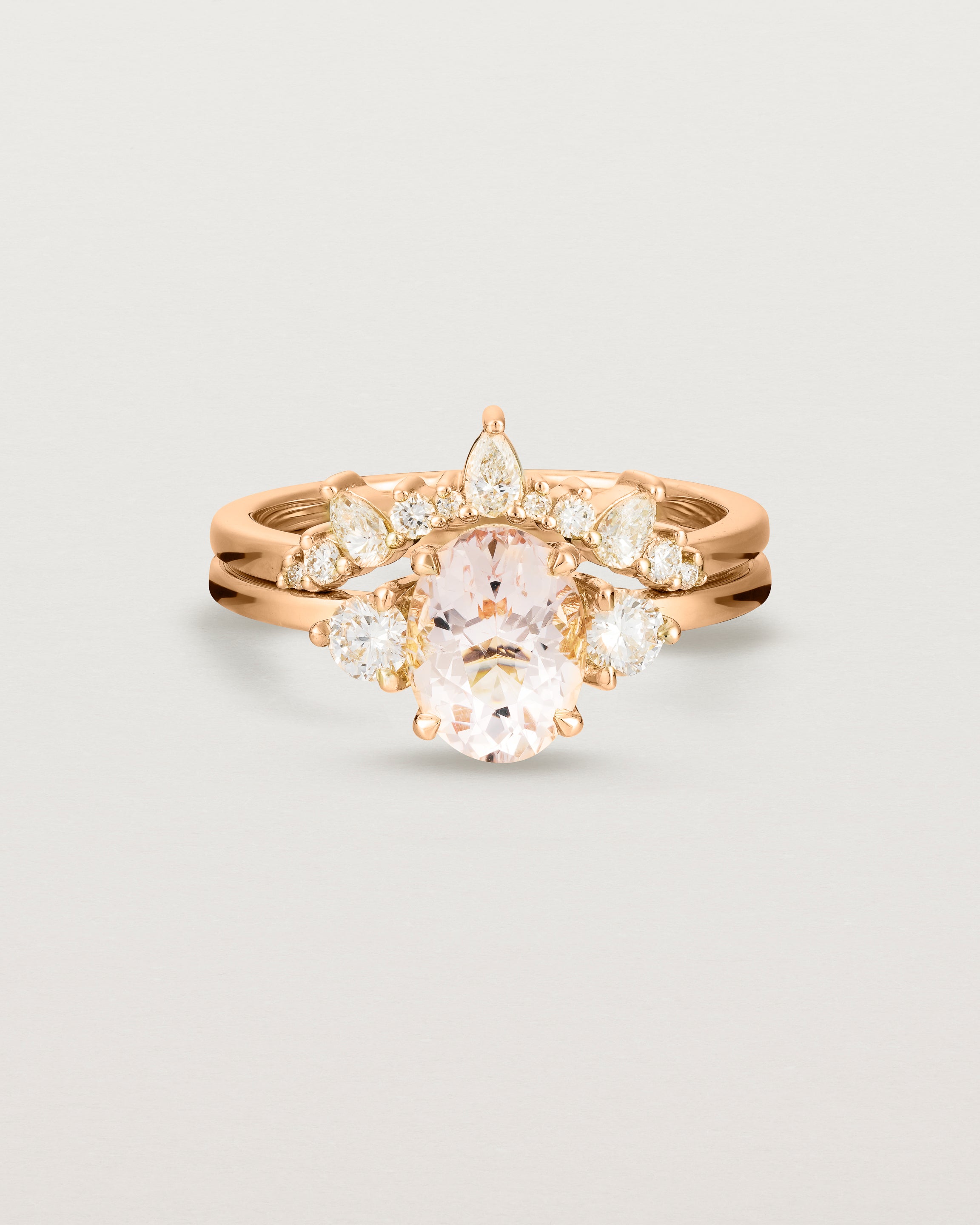 Front view of the Una Oval Trio Ring | Morganite & Diamonds | Rose Gold stacked with the Odette Crown Ring.