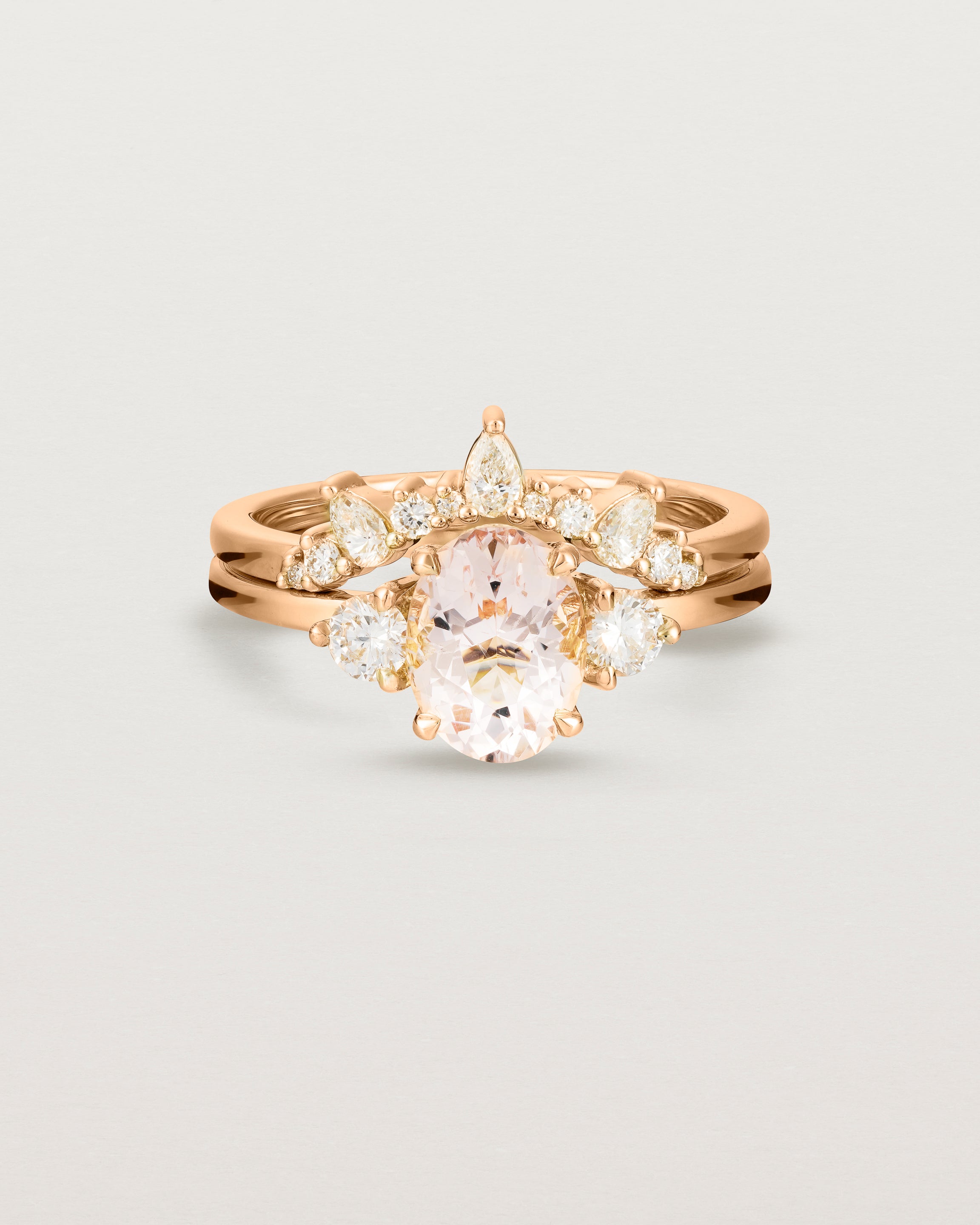 Front view of the Una Oval Trio Ring | Morganite & Diamonds | Rose Gold stacked with the Odette Crown Ring.