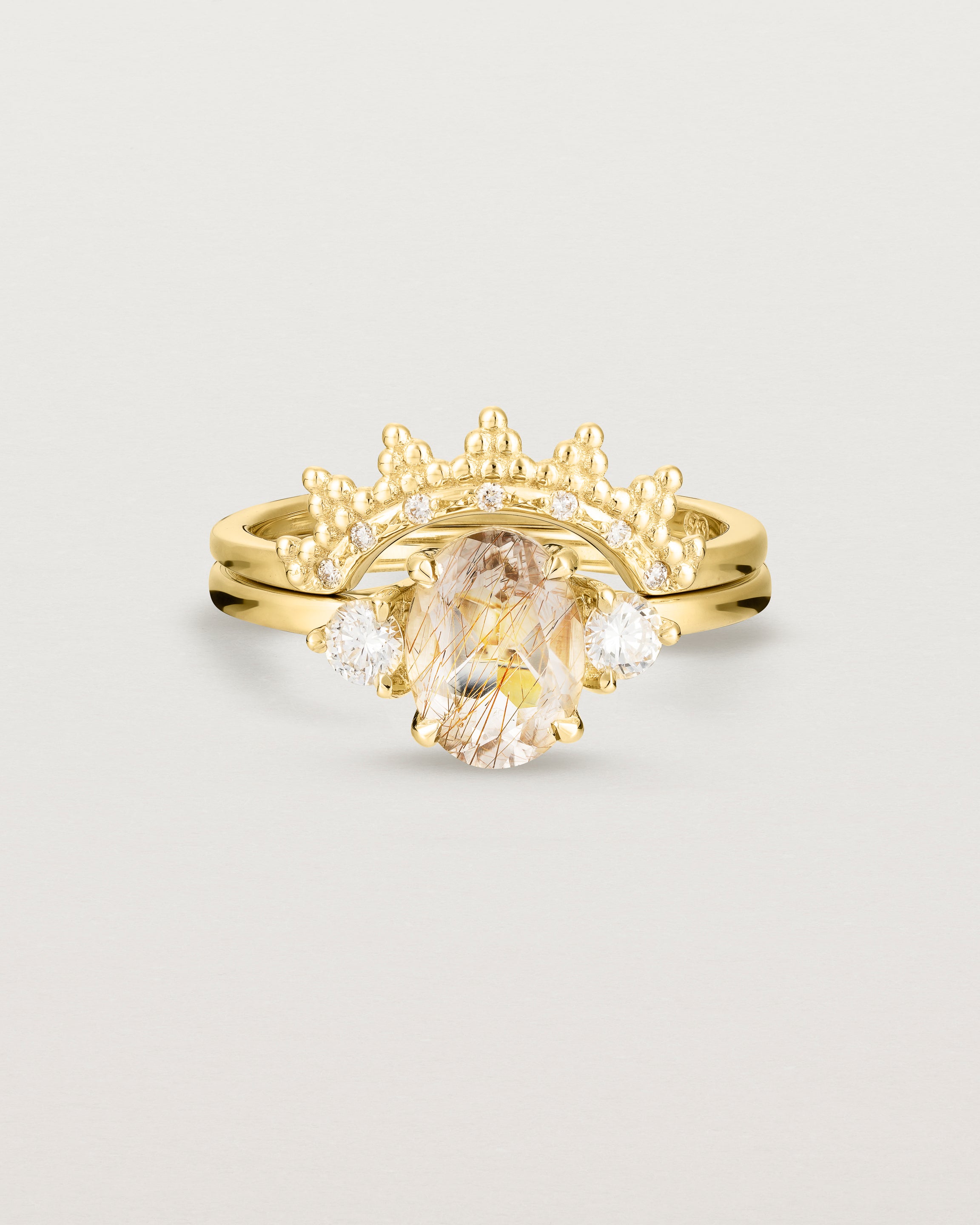 Front view of the Una Oval Trio Ring | Rutilated Quartz & Diamonds | Yellow Gold stacked with the Odine Crown Ring | Diamonds.