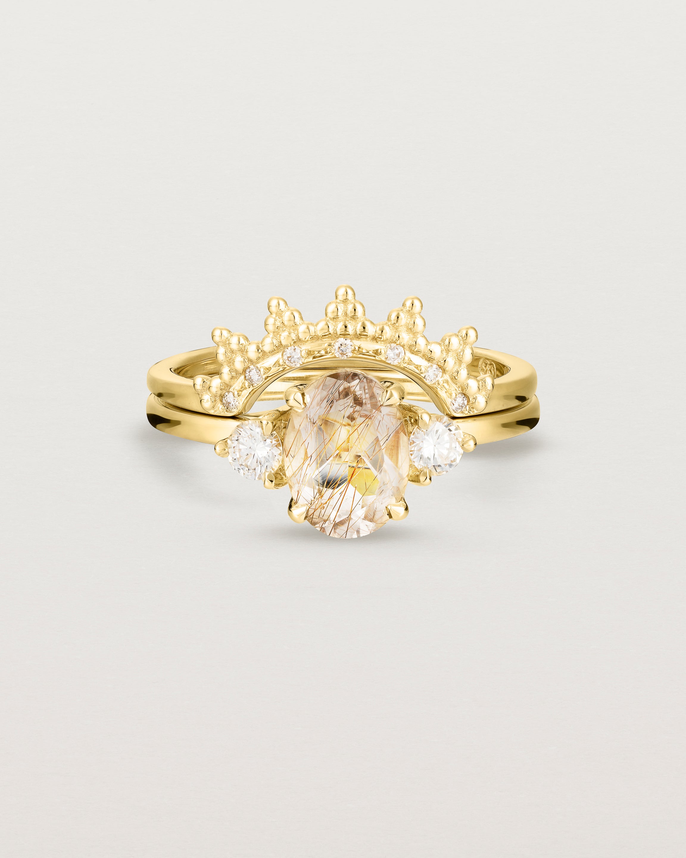 Front view of the Una Oval Trio Ring | Rutilated Quartz & Diamonds | Yellow Gold stacked with the Odine Crown Ring | Diamonds.
