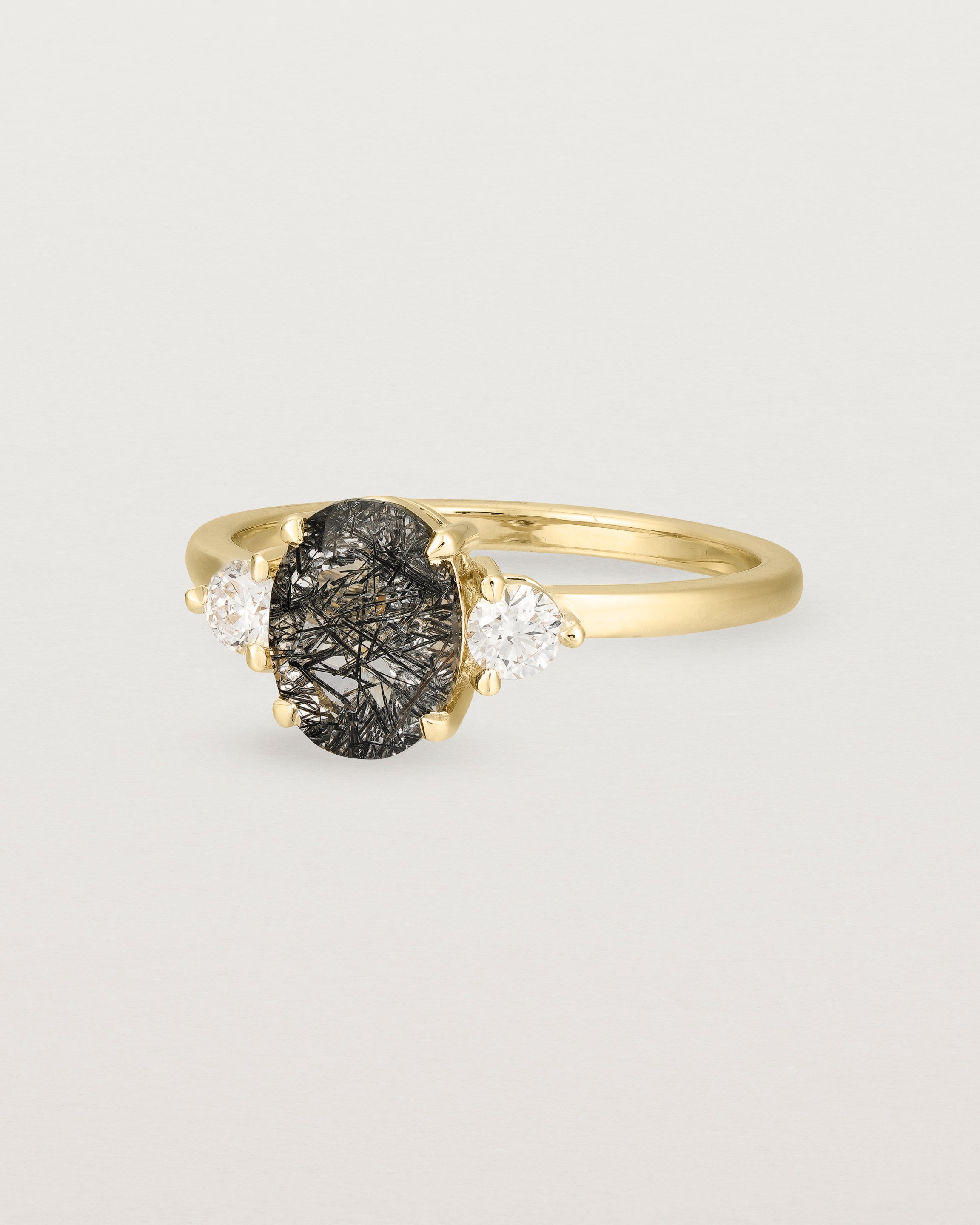 Angled view of the Una Oval Trio Ring | Tourmalinated Quartz & Diamonds | Yellow Gold.