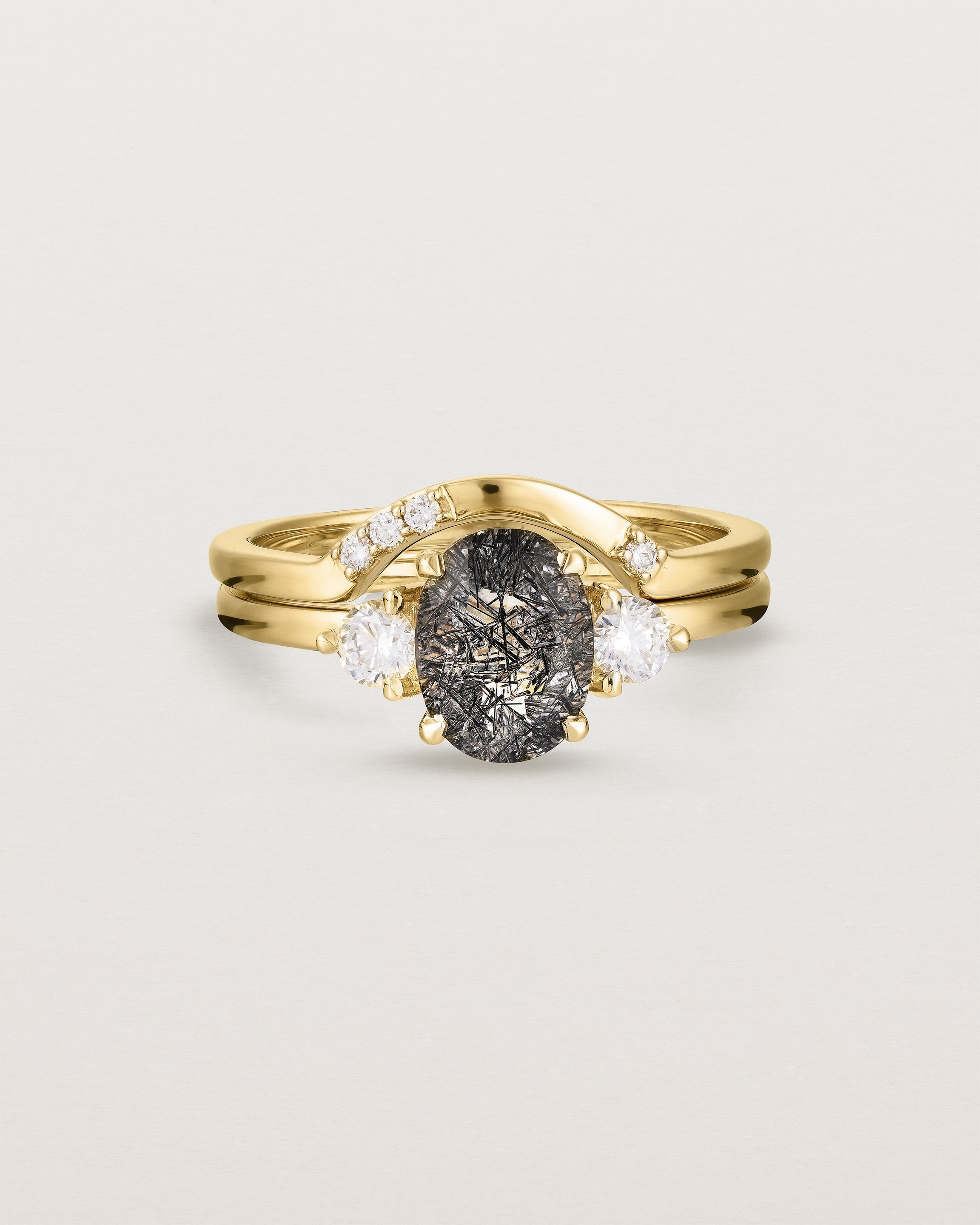 Front view of the Una Oval Trio Ring | Tourmalinated Quartz & Diamonds | Yellow Gold stacked with the Cecile Crown Ring | Diamonds.