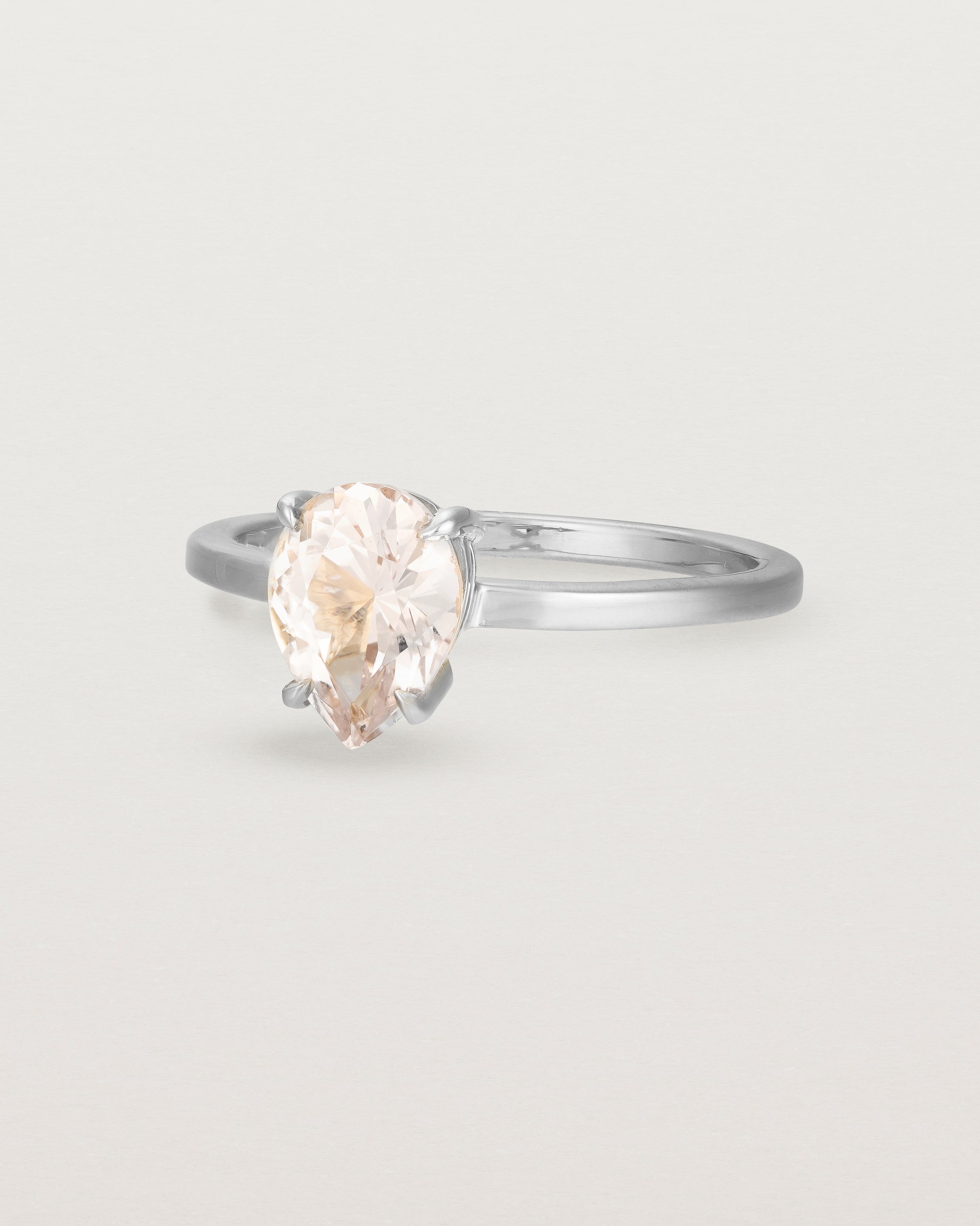 Angled view of the Una Pear Solitaire | Morganite | White Gold.