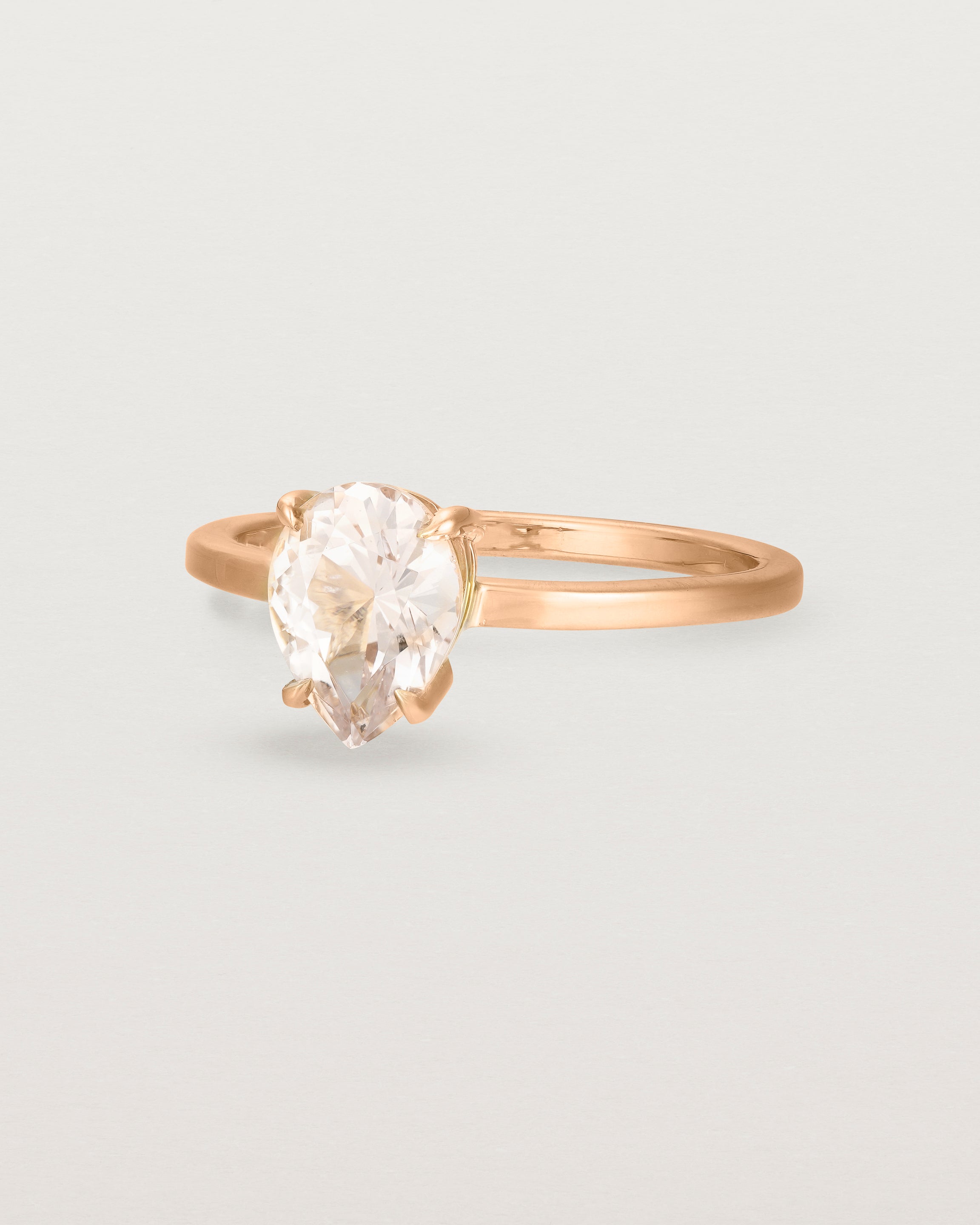 Angled view of the Una Pear Solitaire | Morganite | Rose Gold.