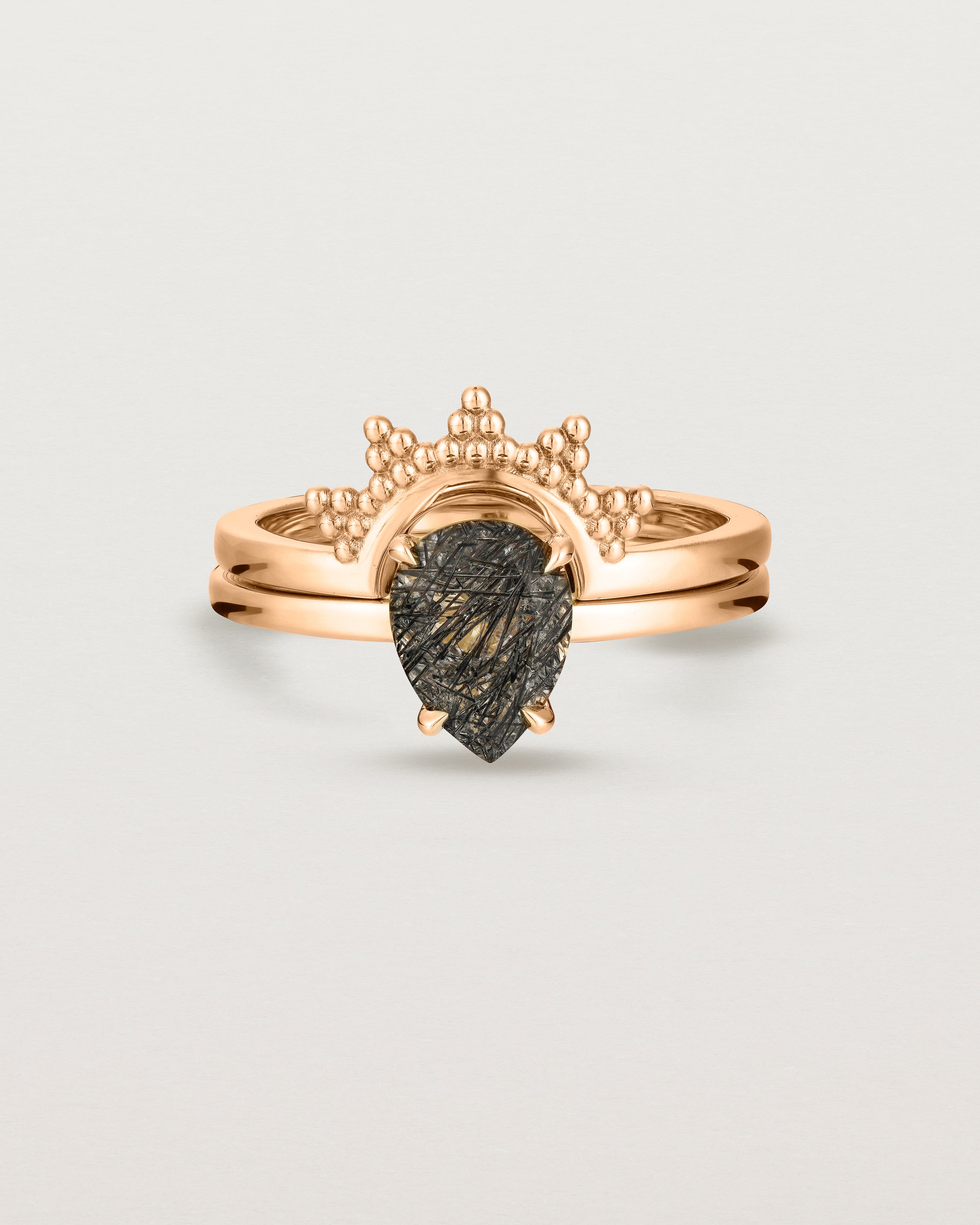 Front view of the Una Pear Solitaire | Tourmalinated Quartz | Rose Gold stacked with the Odine Crown Ring.