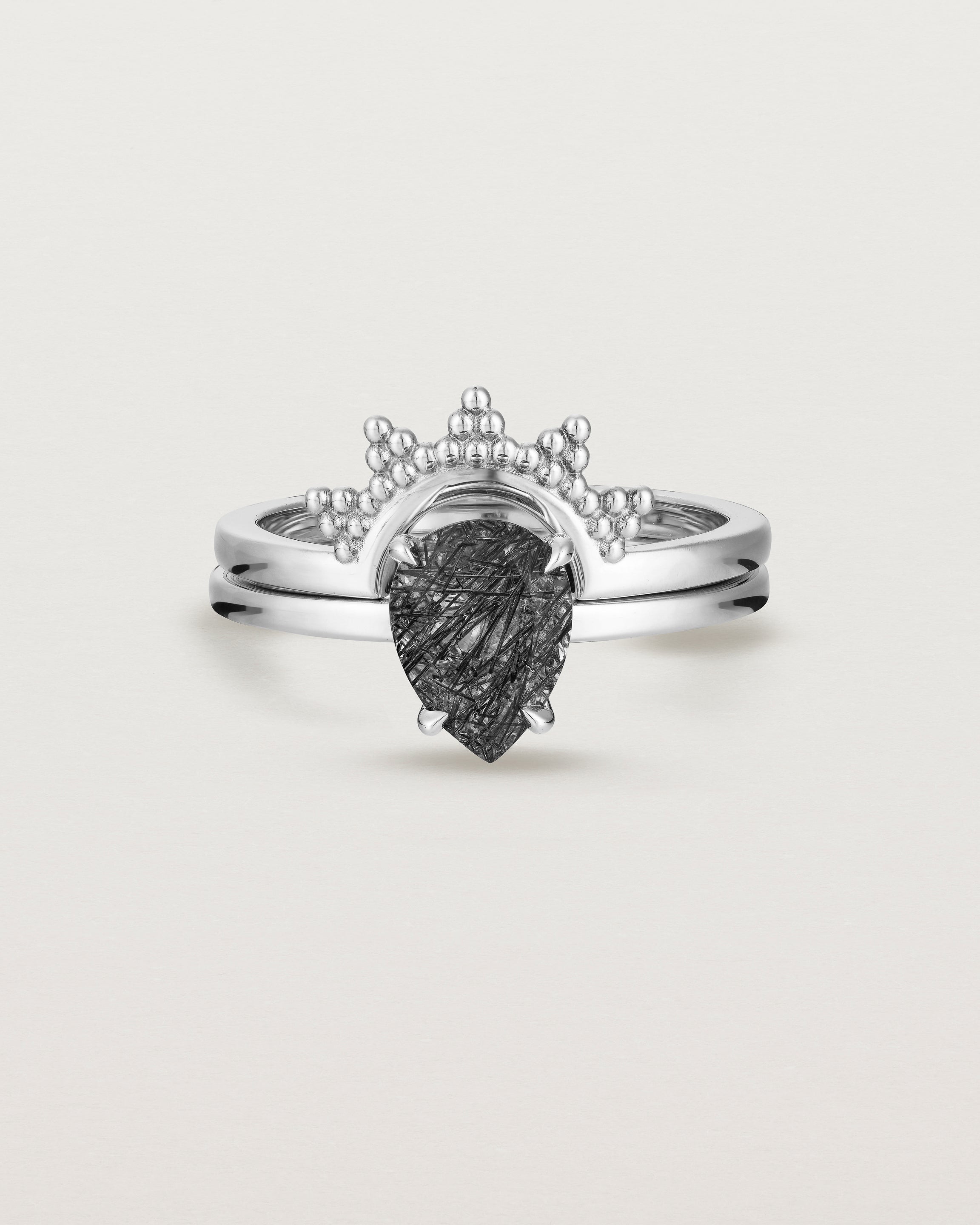 Front view of the Una Pear Solitaire | Tourmalinated Quartz | White Gold stacked with the Odine Crown Ring.