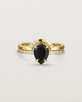 Front view of the Una Pear Solitaire | Black Spinel | Yellow Gold with Cascade Shoulders stacked with Cecile Crown Ring | Diamonds.