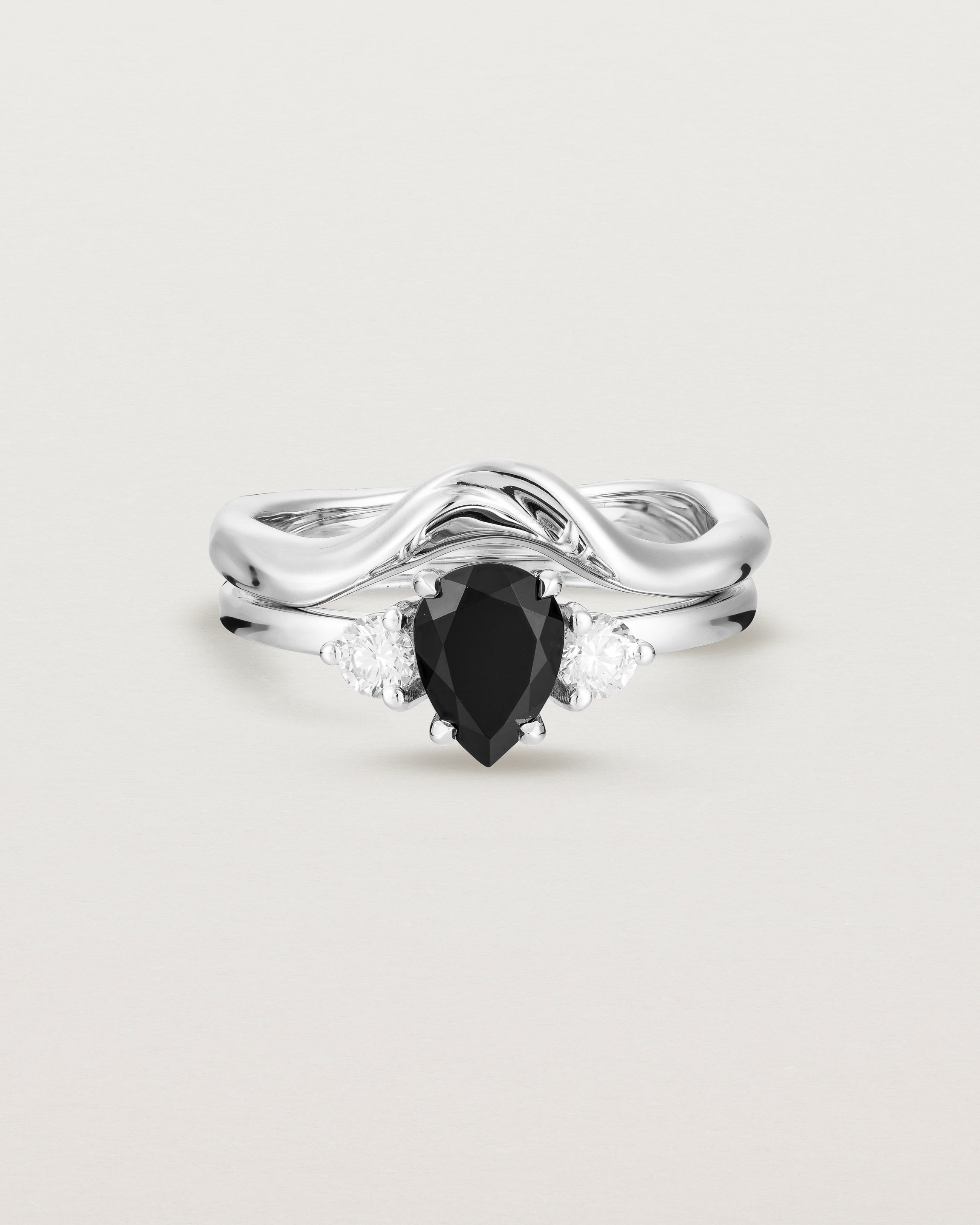 Front view of the Una Pear Trio Ring | Black Spinel & Diamonds | White Gold paired with an Organic Crown Ring.