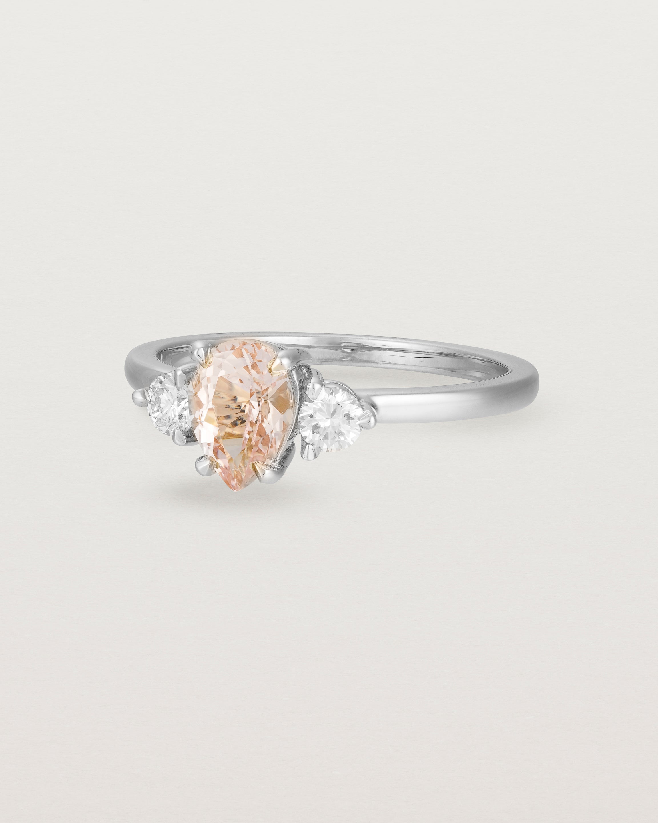 Angled view of the Una Pear Trio Ring | Morganite & Diamonds | White Gold.