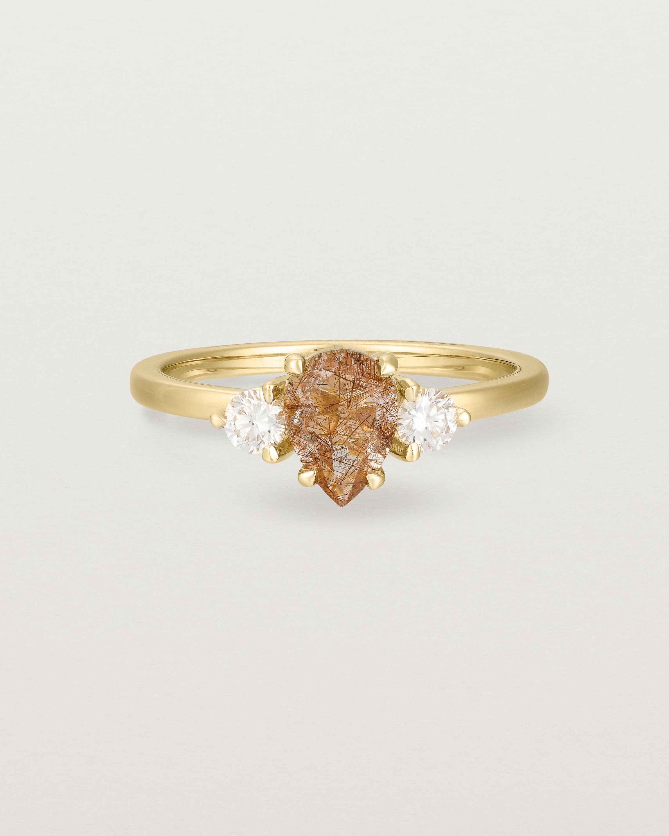 Front view of the Una Pear Trio Ring | Rutilated Quartz & Diamonds | Yellow Gold.