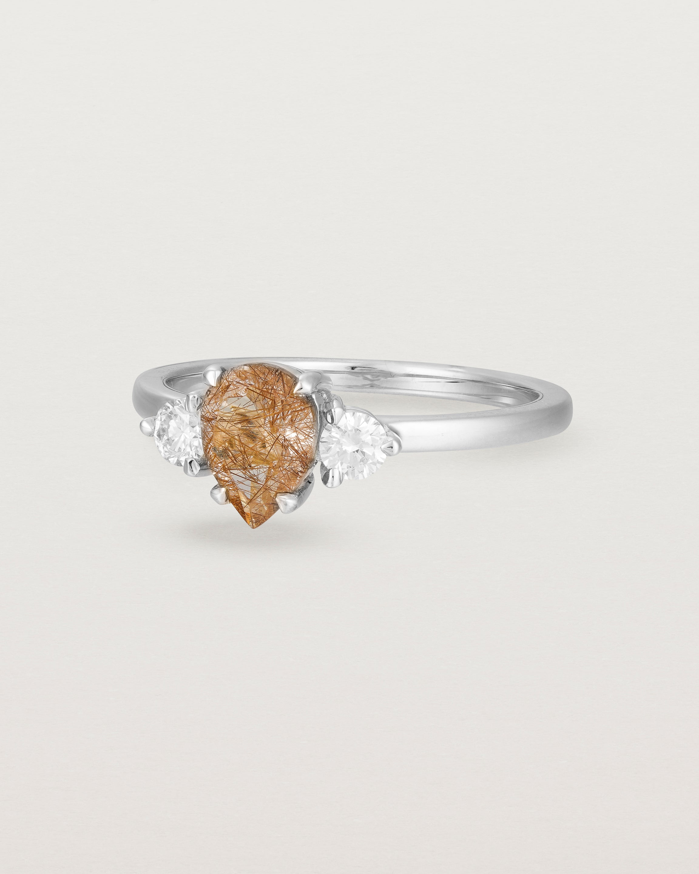 Angled view of the Una Pear Trio Ring | Rutilated Quartz & Diamonds | White Gold.