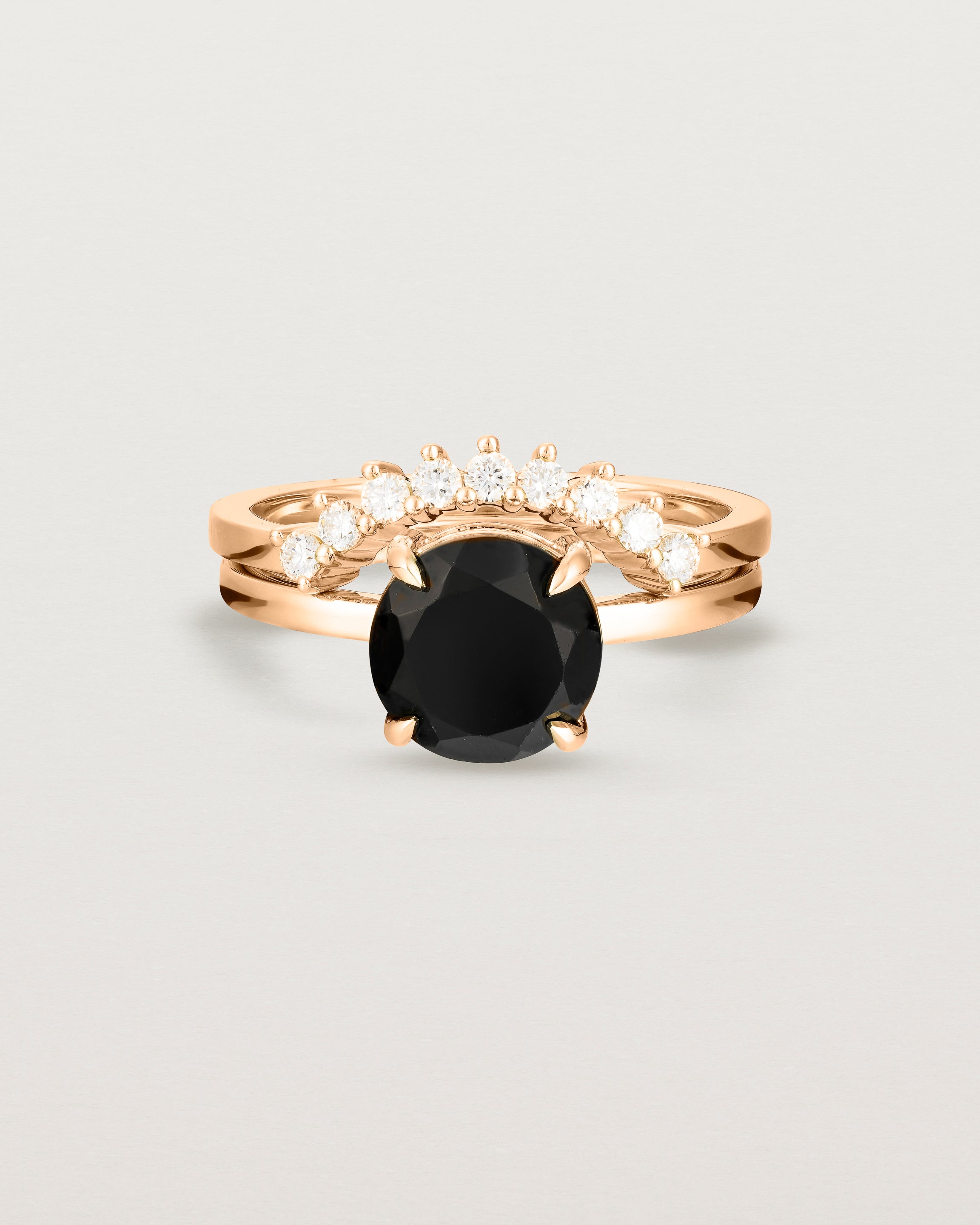 Front view of the Una Round Solitaire | Black Spinel | Rose Gold paired with the Reina Crown Ring | Diamonds. 