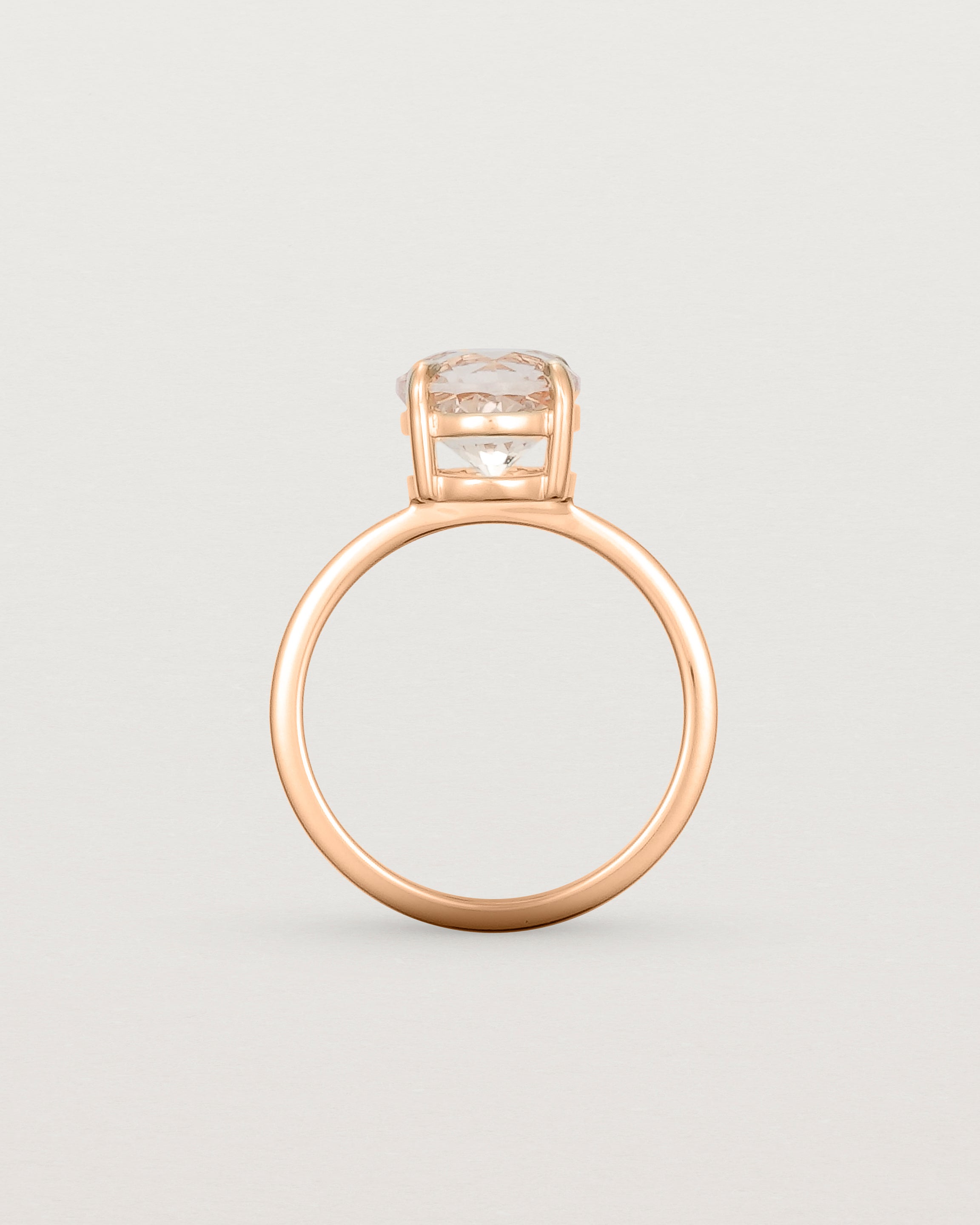 Standing view of the Una Round Solitaire | Morganite | Rose Gold stacked with the Adeline Crown Ring. 
