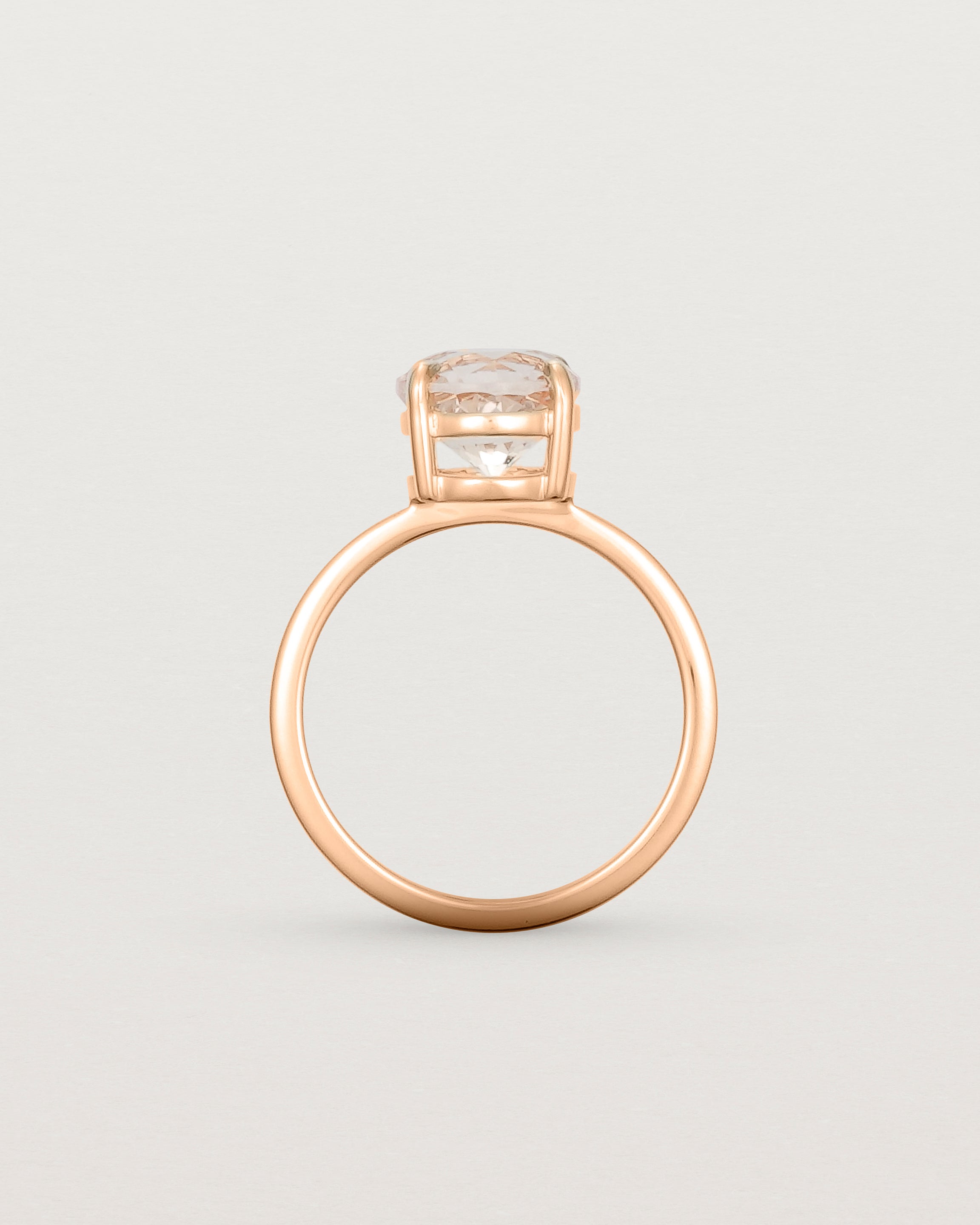 Standing view of the Una Round Solitaire | Morganite | Rose Gold stacked with the Adeline Crown Ring. 