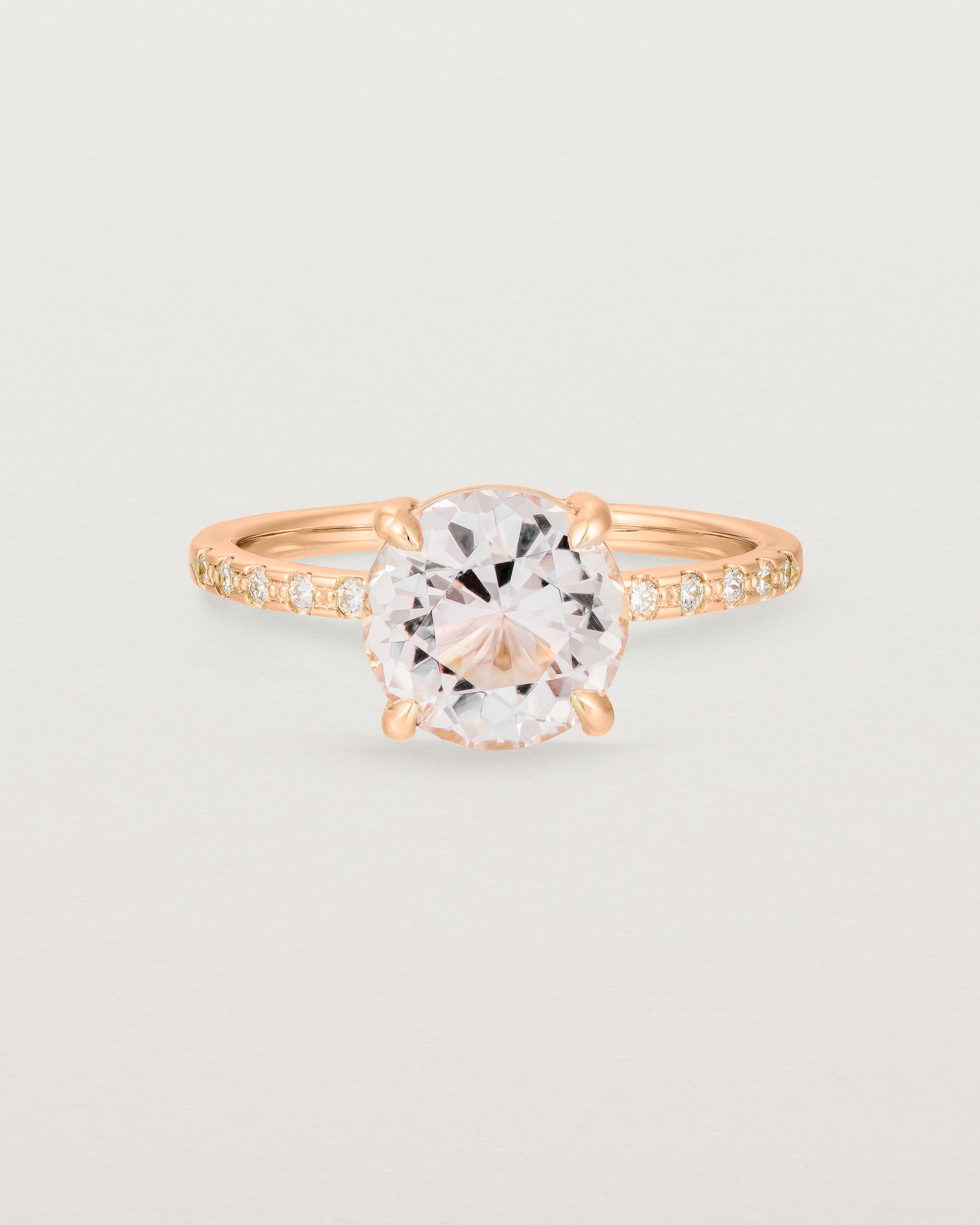 Front view of the Una Round Solitaire | Morganite | Rose Gold with cascade Diamond shoulders.