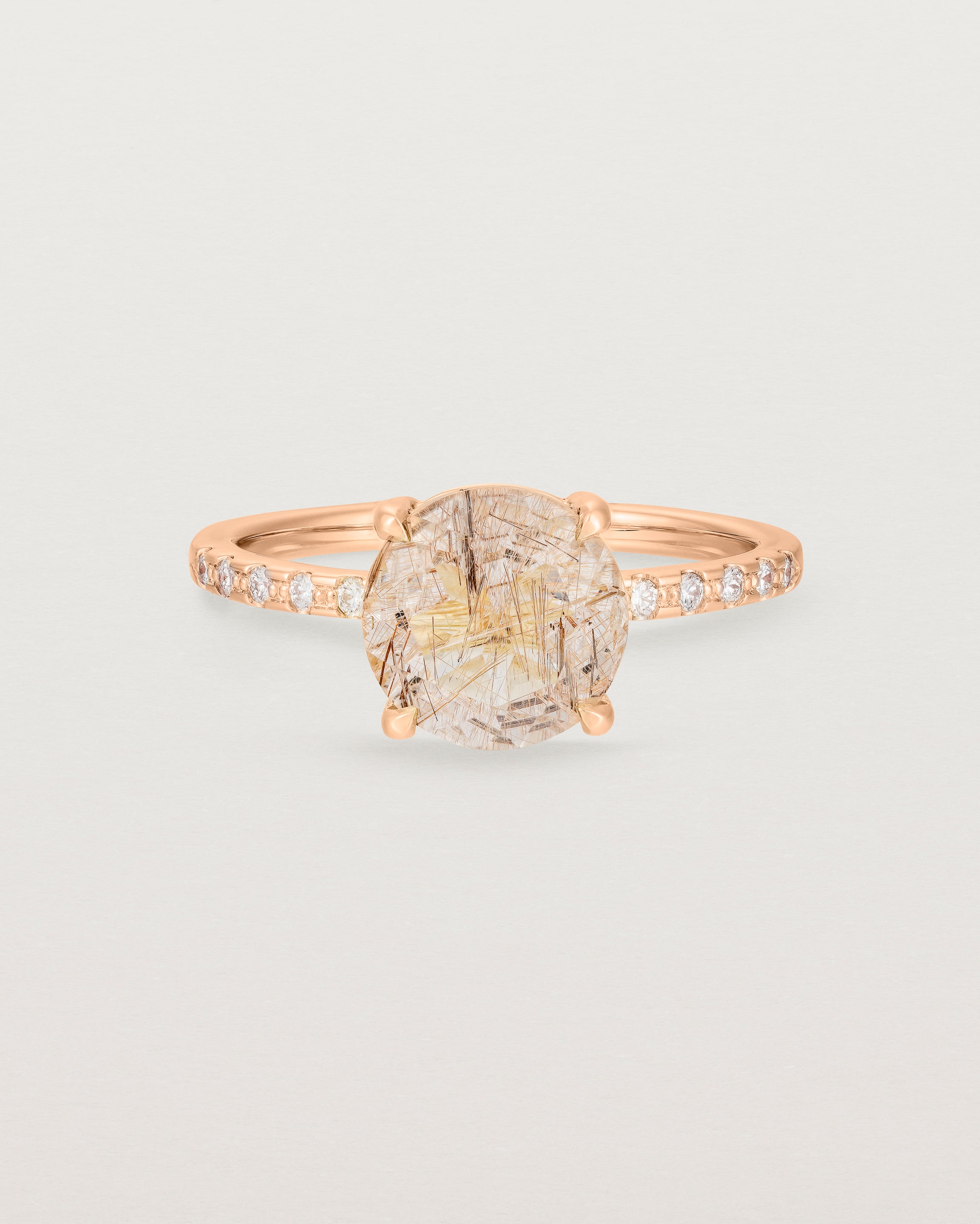 Front view of the Front view of the Una Round Solitaire | Rutilated Quartz | Rose Gold with Cascade Shoulders.