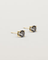 Angled view of the Una Studs | Tourmalinated Quartz in yellow gold.
