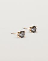 Angled view of the Una Studs | Tourmalinated Quartz in rose gold.