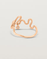 Back facing deep etched image of a rose gold ring with birthstone charms.