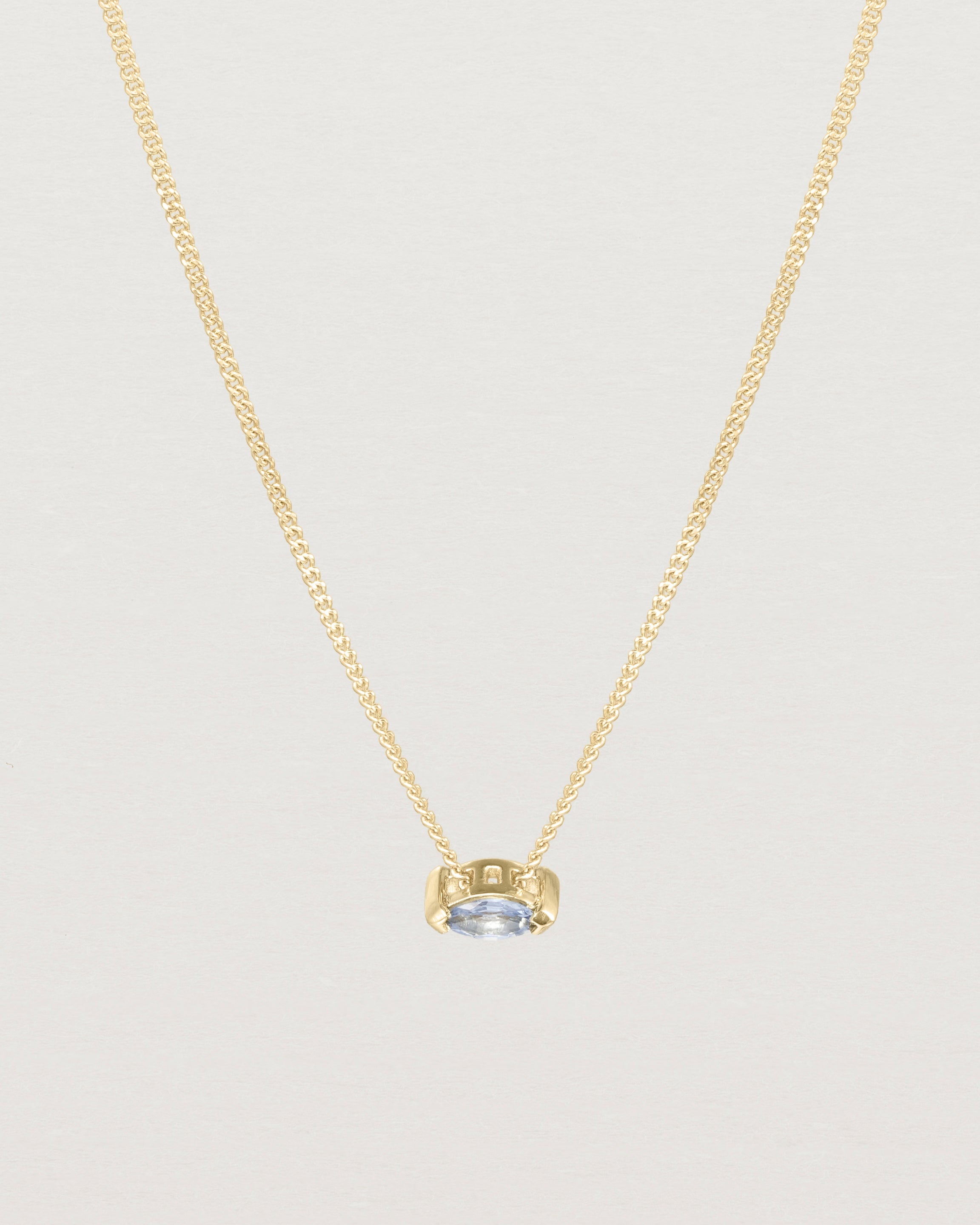 Front view of the Vega Slider Necklace | Sapphire | Yellow Gold.