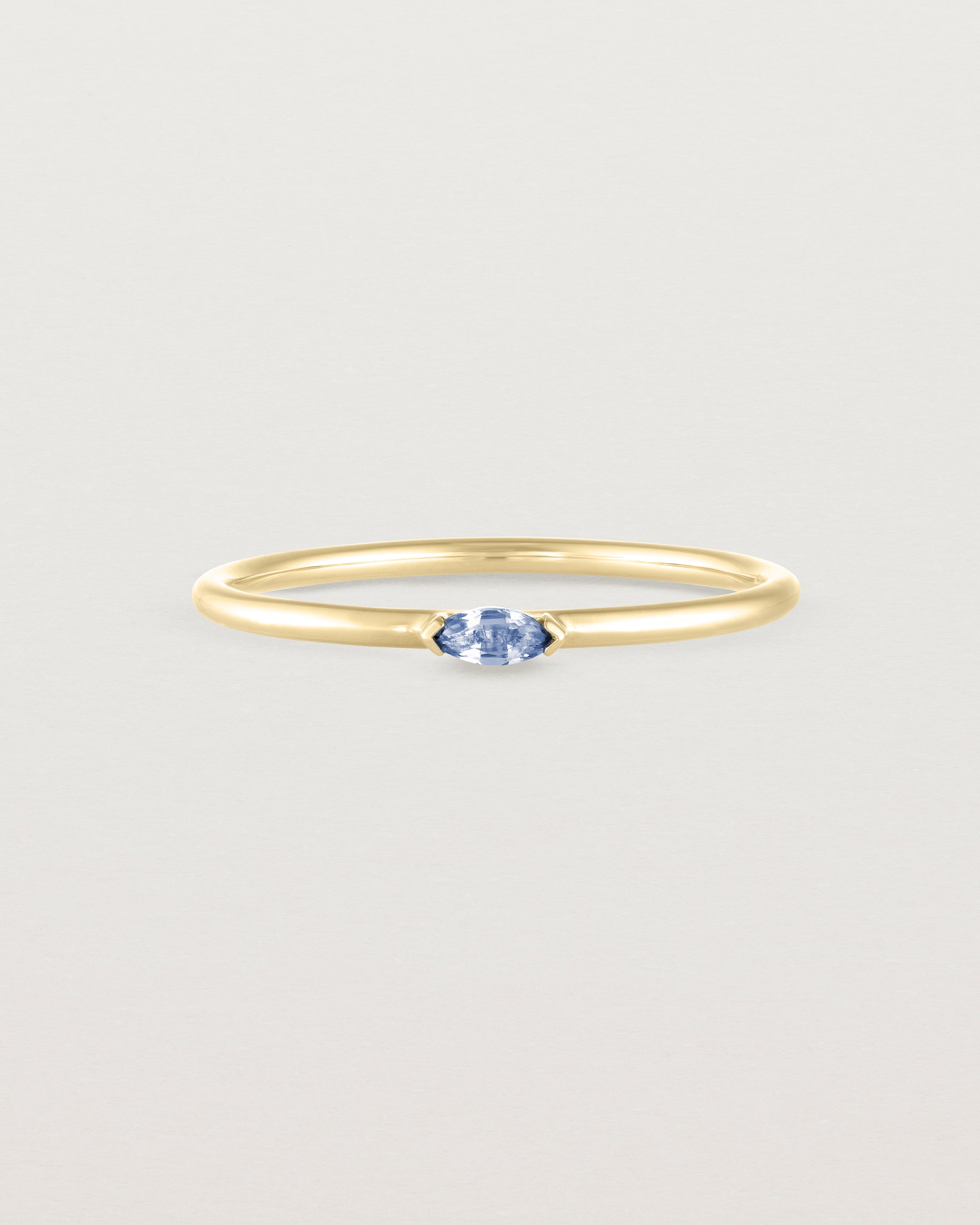 Front view of the Vega Stacking Ring | Sapphire in yellow gold.