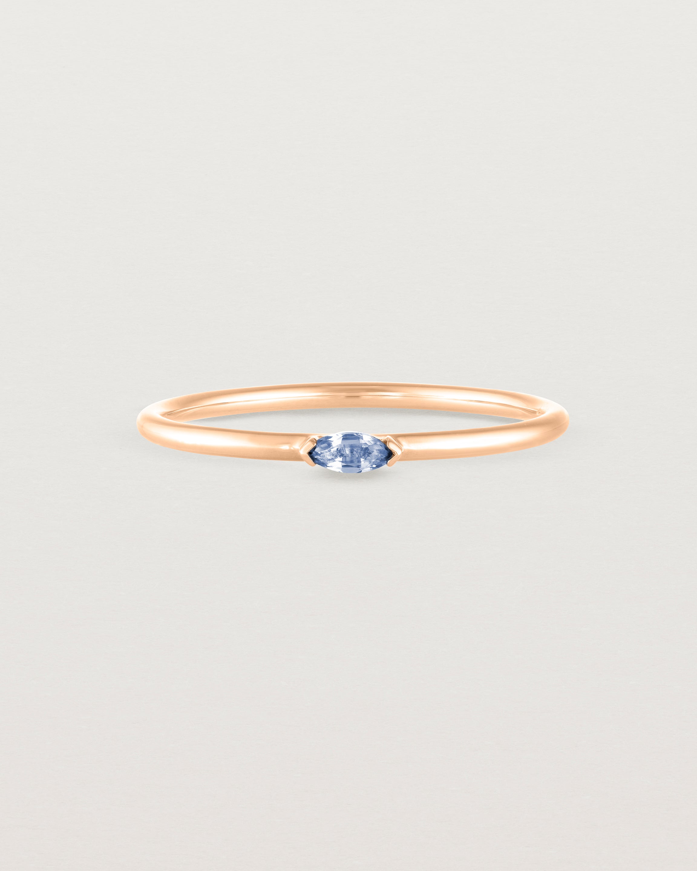 Front view of the Vega Stacking Ring | Sapphire in rose gold.