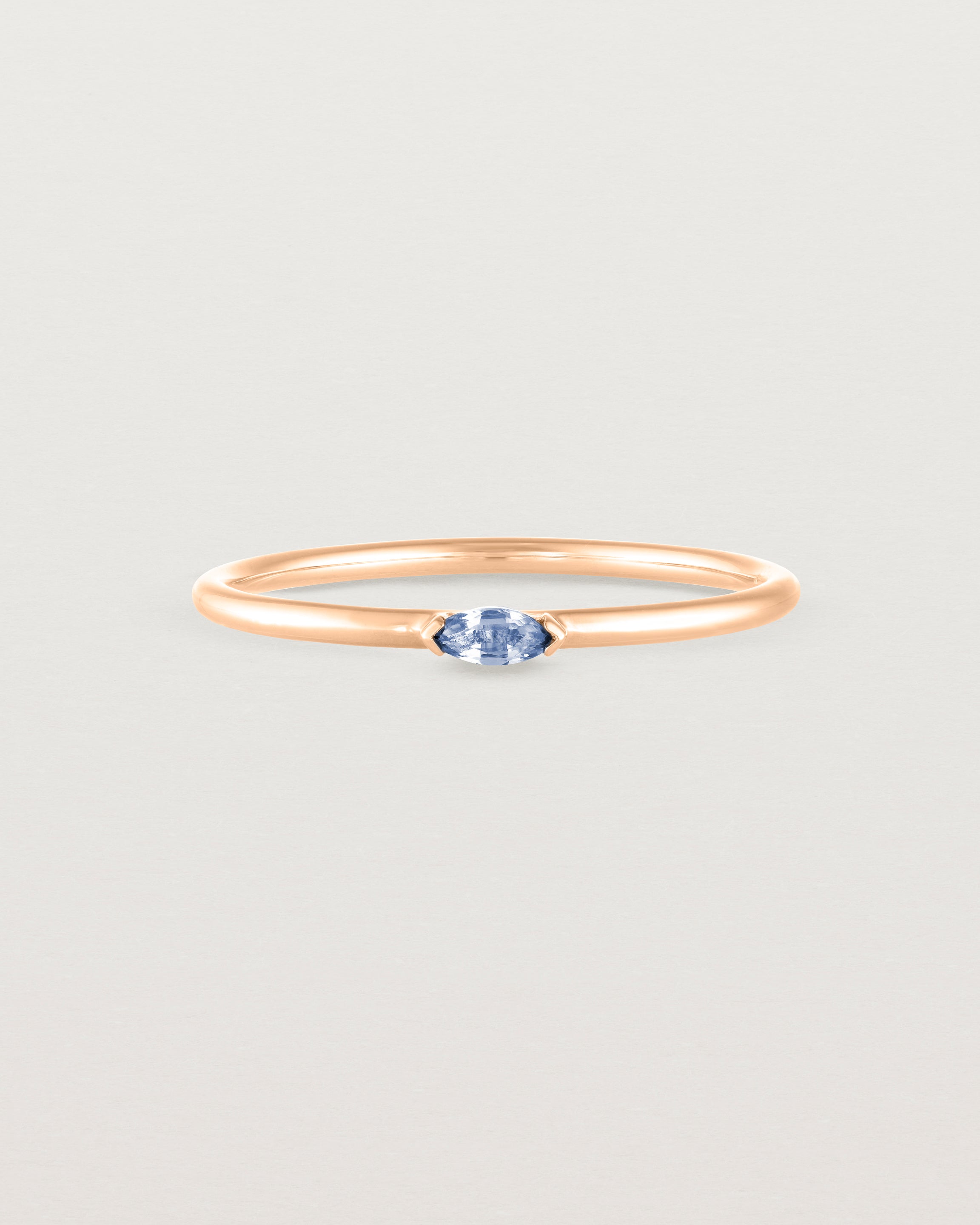 Front view of the Vega Stacking Ring | Sapphire in rose gold.