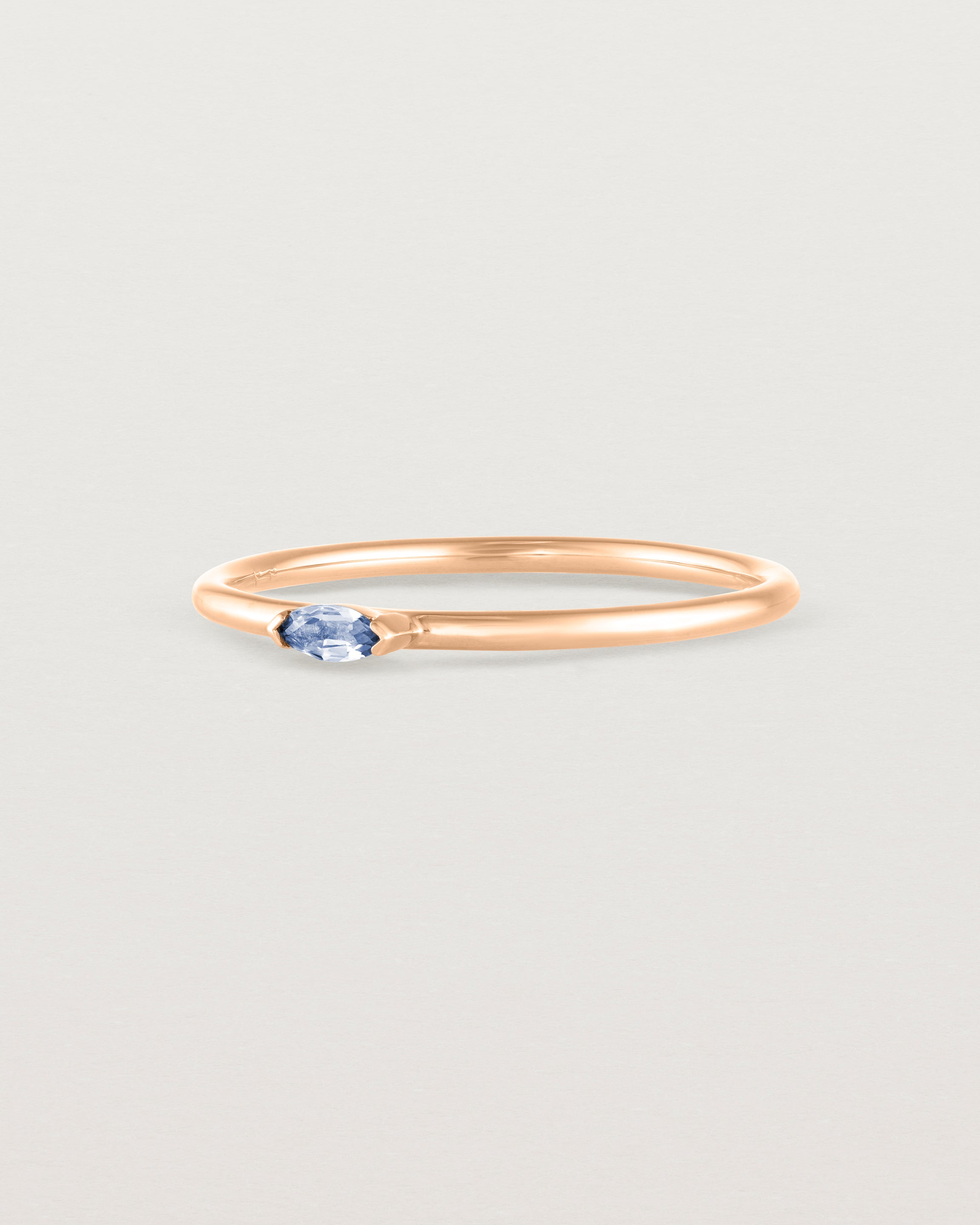 Angled view of the Vega Stacking Ring | Sapphire in rose gold.