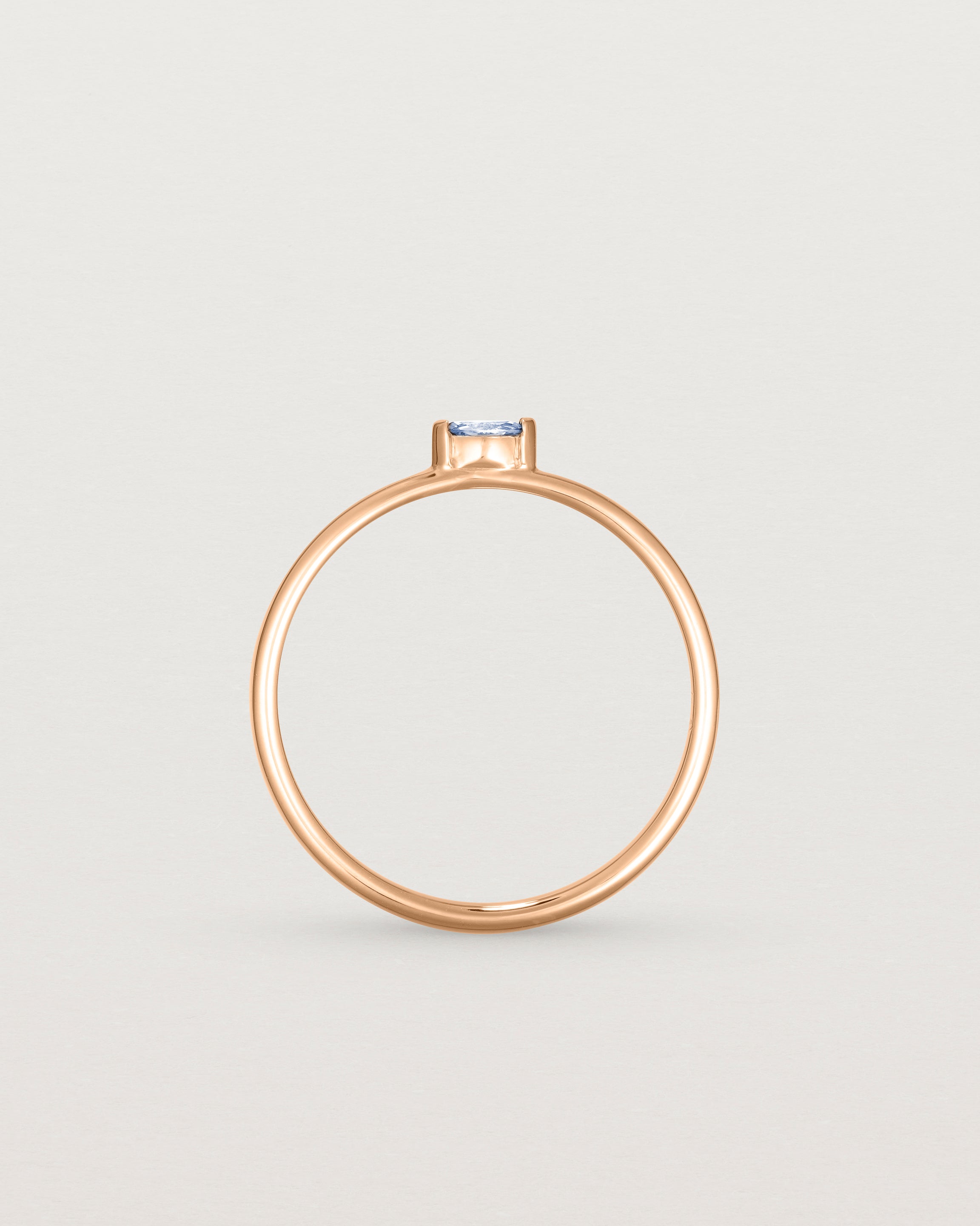 Standing view of the Vega Stacking Ring | Sapphire in rose gold.