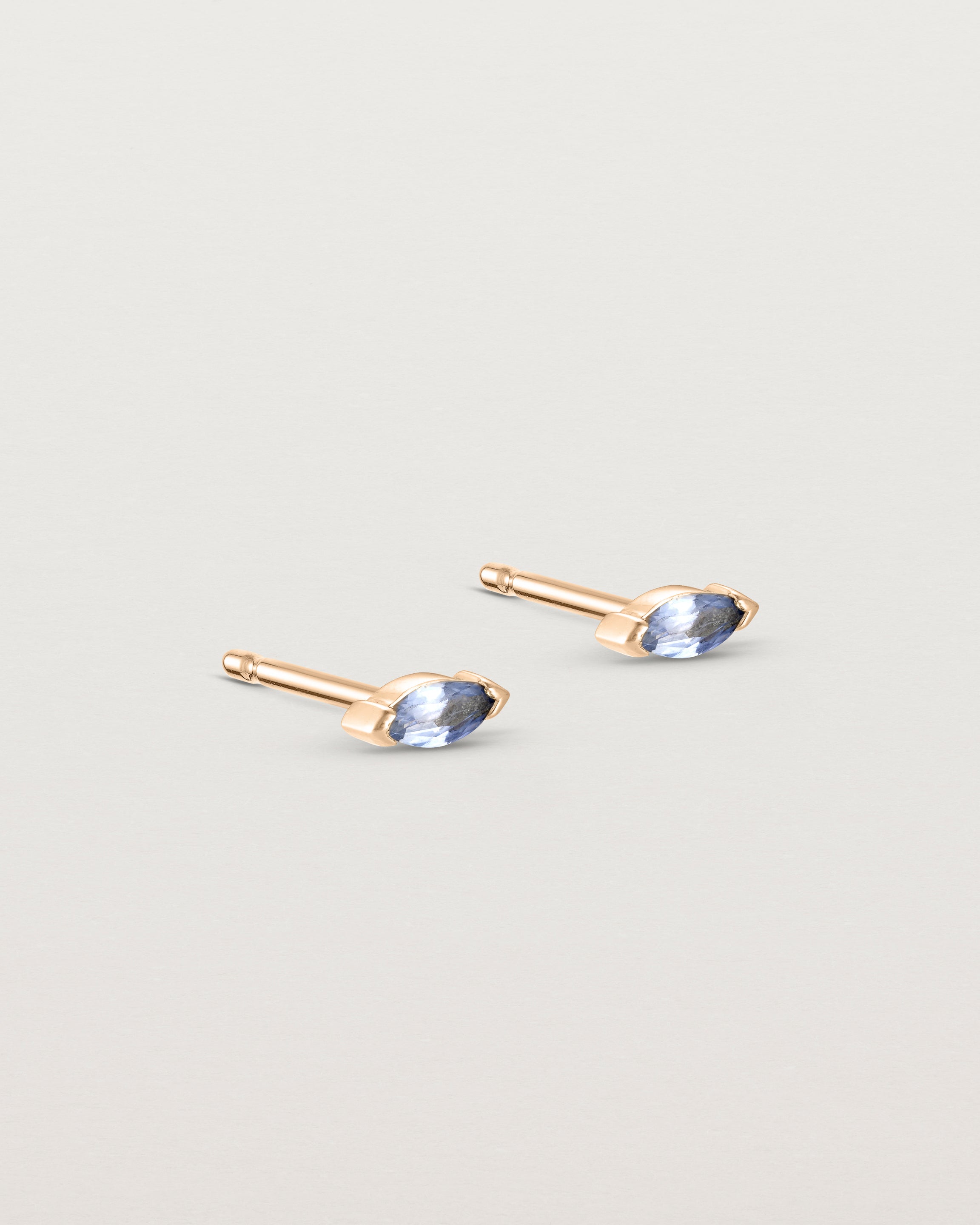 Angled view of the Vega Studs | Sapphire in rose gold.